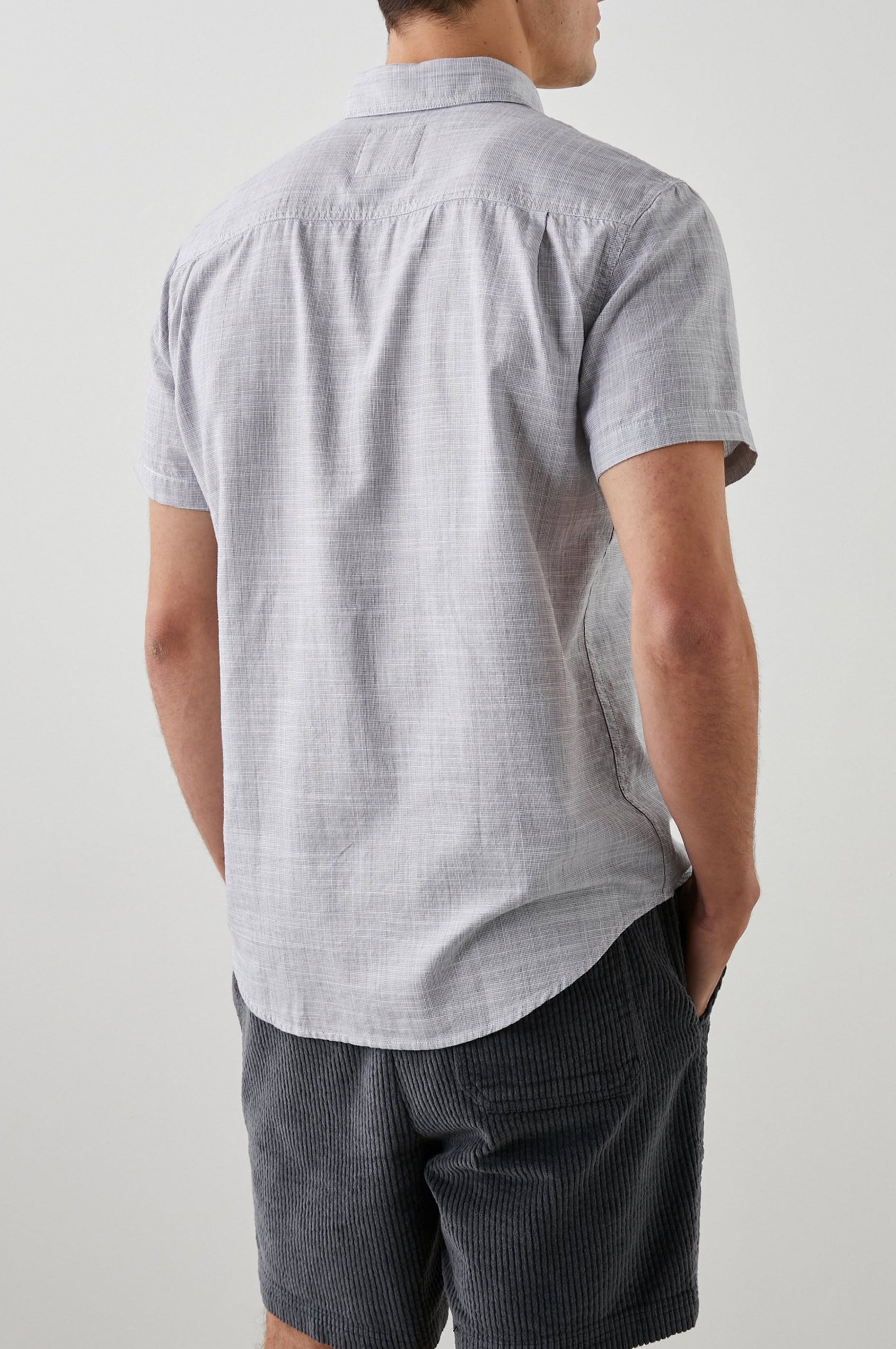 Fairfax Short-Sleeve Button Up with a Chest Patch Pocket in Iron Gate Colorway - Back View Featured on Model