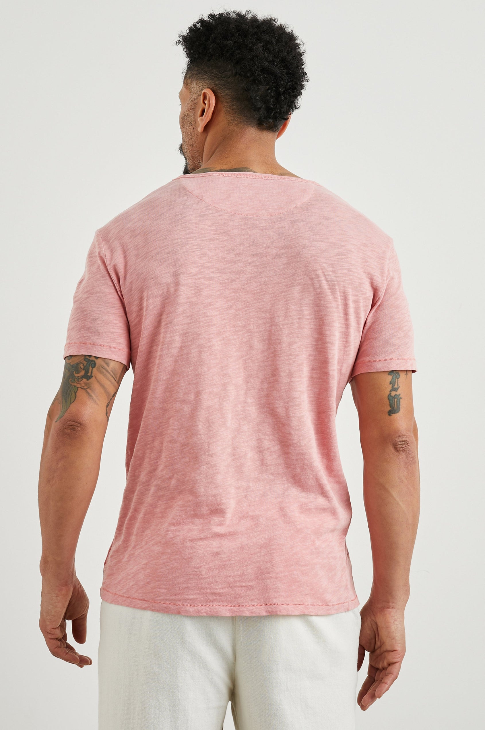Skipper Short-Sleeve T-shirt with a Crew Neck and a Chest Patch Pocket in Equator Colorway, a Pink - Back View Featured on Model