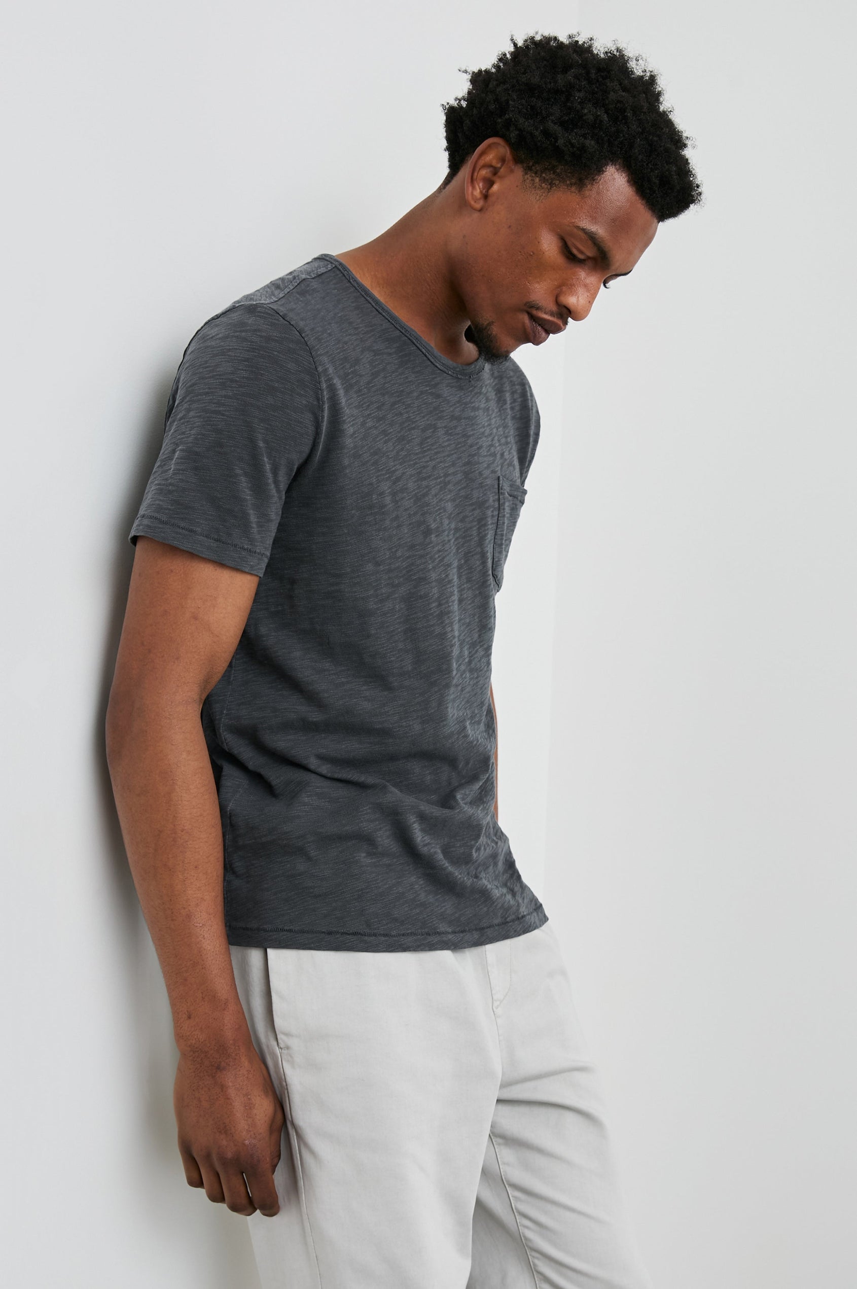 Skipper Short-Sleeve T-shirt with a Crew Neck and a Chest Patch Pocket in Faded Navy Colorway - Side View Featured on Model