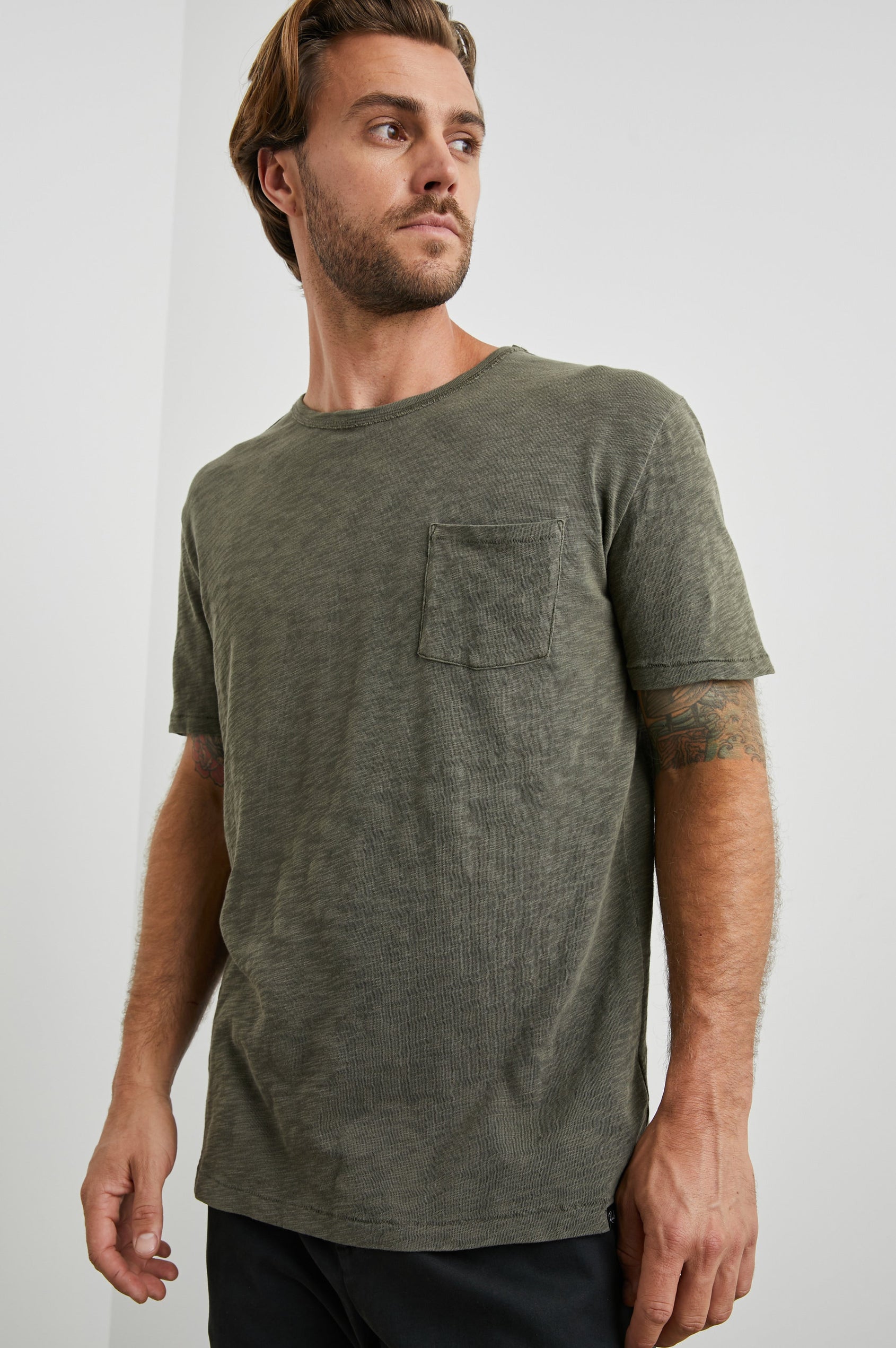 Skipper Short-Sleeve T-shirt with a Crew Neck and a Chest Patch Pocket in Surplus Colorway, a green - Front View Featured on Model