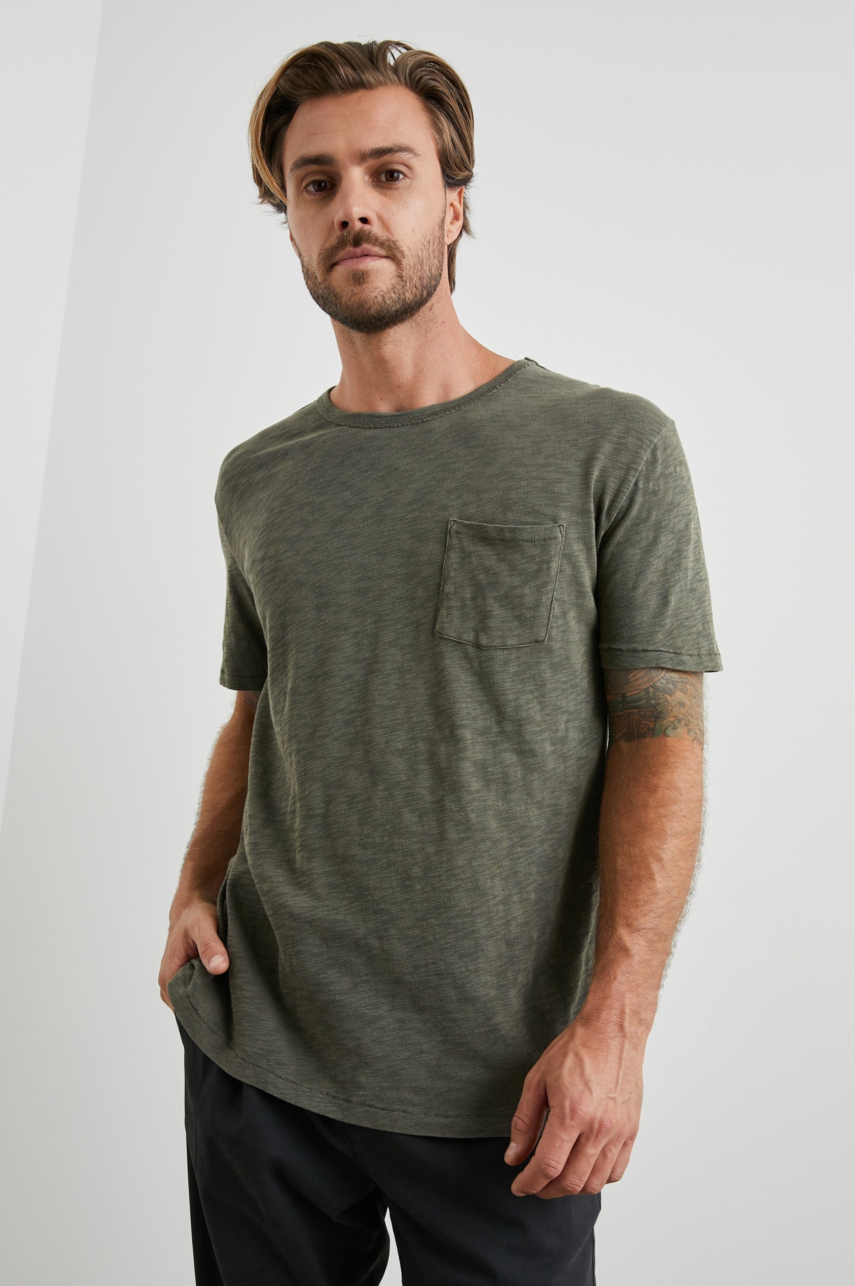 Skipper Short-Sleeve T-shirt with a Crew Neck and a Chest Patch Pocket in Surplus Colorway, a green - Front View Featured on Model