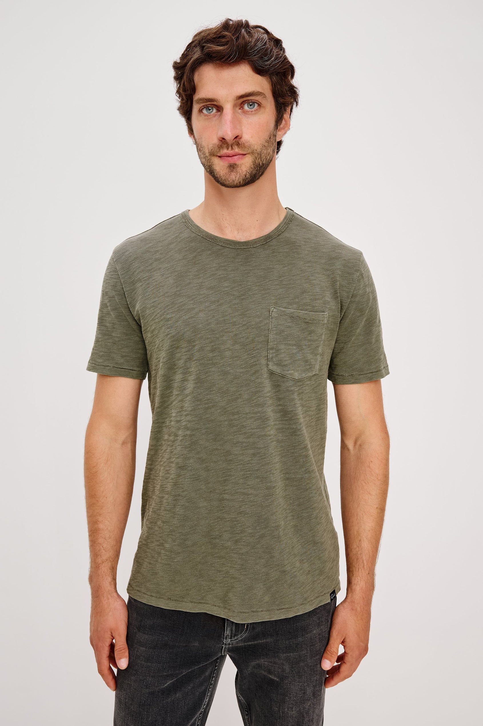 Skipper Short-Sleeve T-shirt with a Crew Neck and a Chest Patch Pocket in Surplus Colorway, a green - Front View Featured on Model