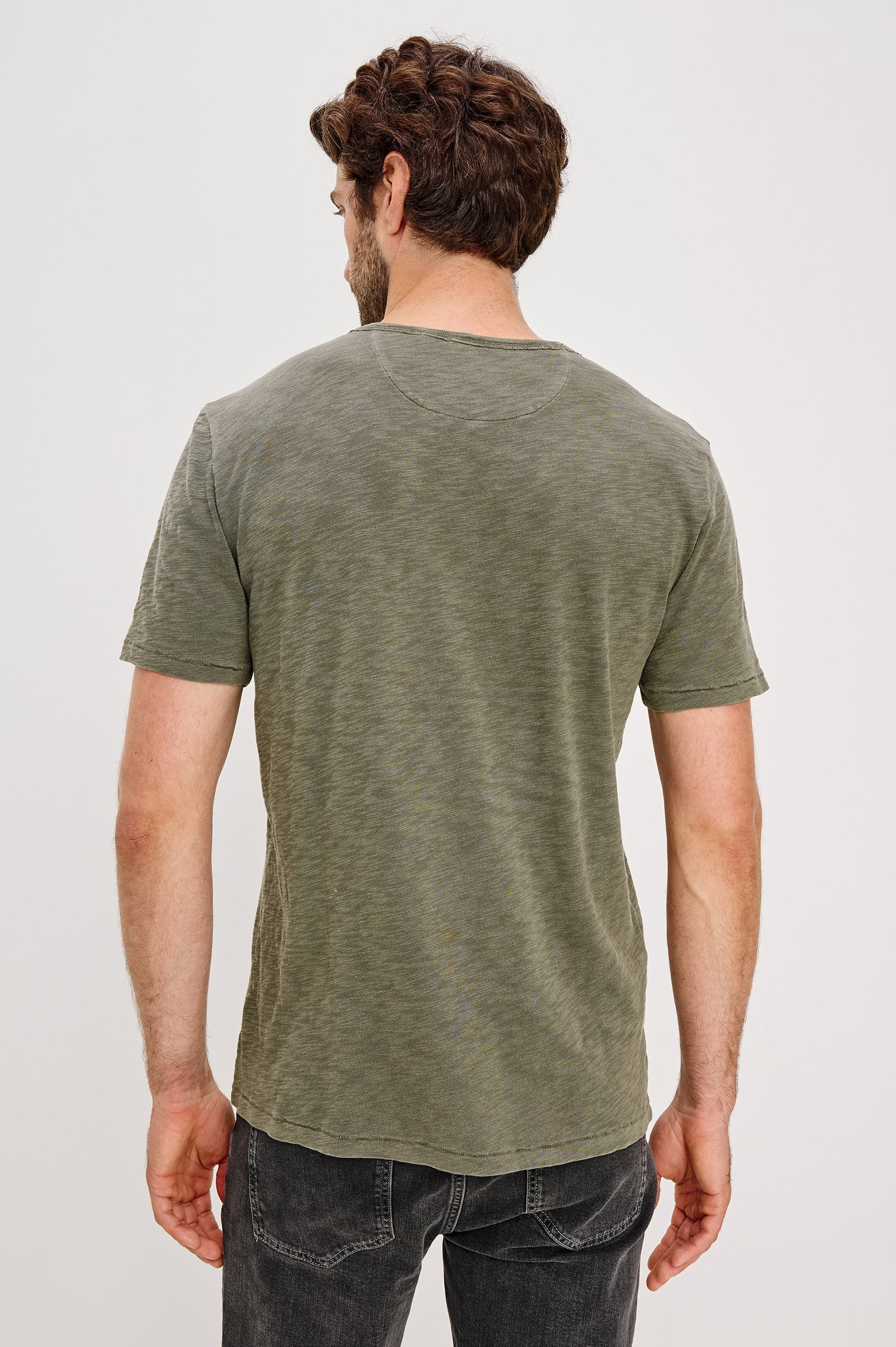 Skipper Short-Sleeve T-shirt with a Crew Neck and a Chest Patch Pocket in Surplus Colorway, a green - Back View Featured on Model