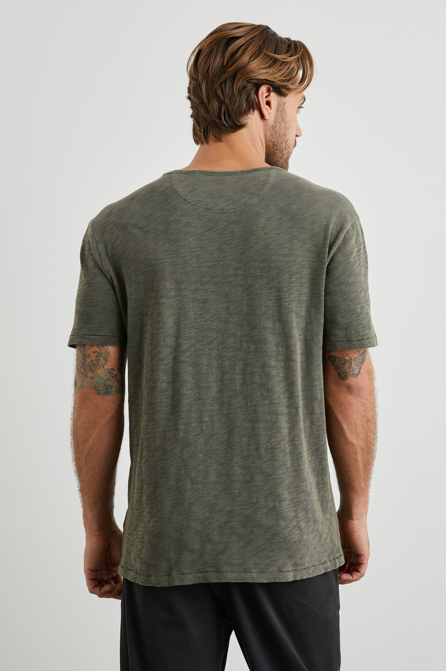 Skipper Short-Sleeve T-shirt with a Crew Neck and a Chest Patch Pocket in Surplus Colorway, a green - Back View Featured on Model