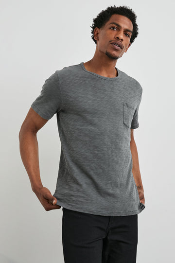 Skipper Short-Sleeve T-shirt with a Crew Neck and a Chest Patch Pocket in Washed Black Colorway - Front View Featured on Model