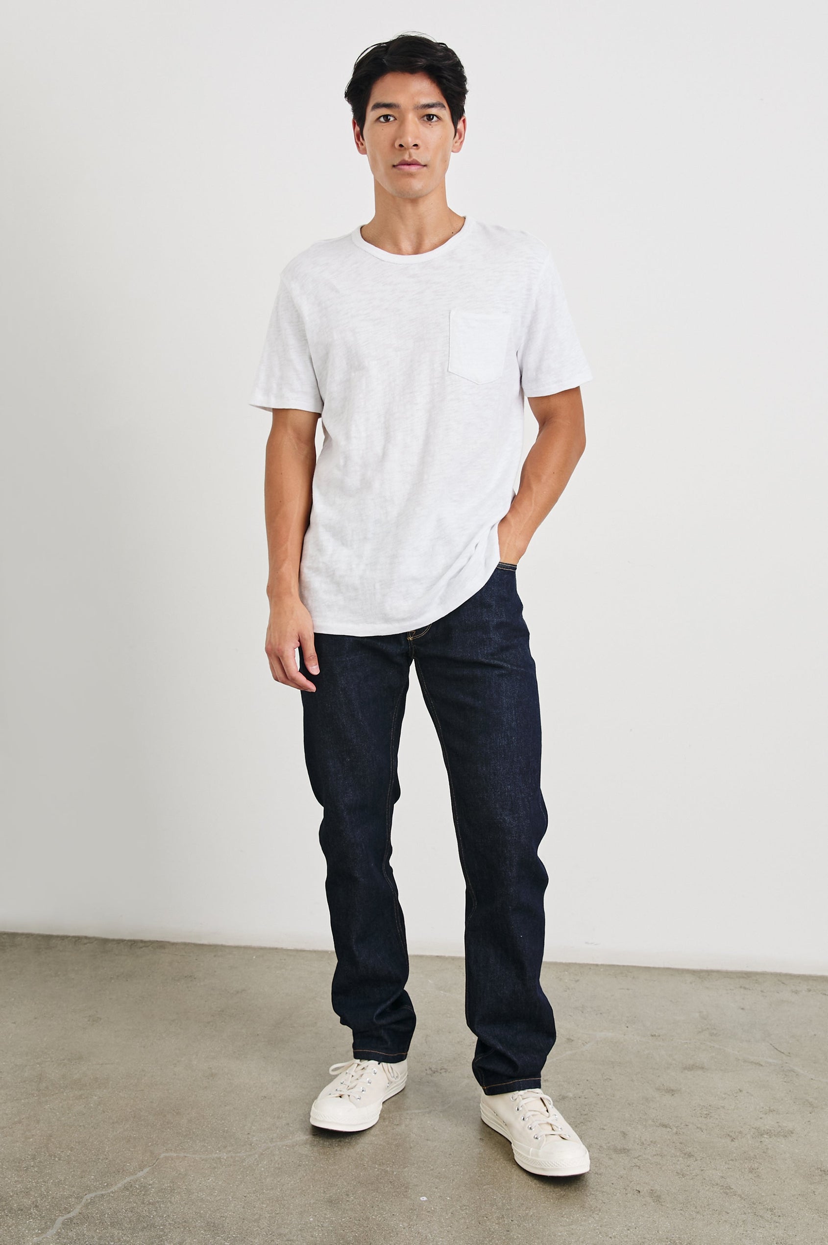 Skipper Short-Sleeve T-shirt with a Crew Neck and a Chest Patch Pocket in White Colorway - Front Full Body View Featured on Model