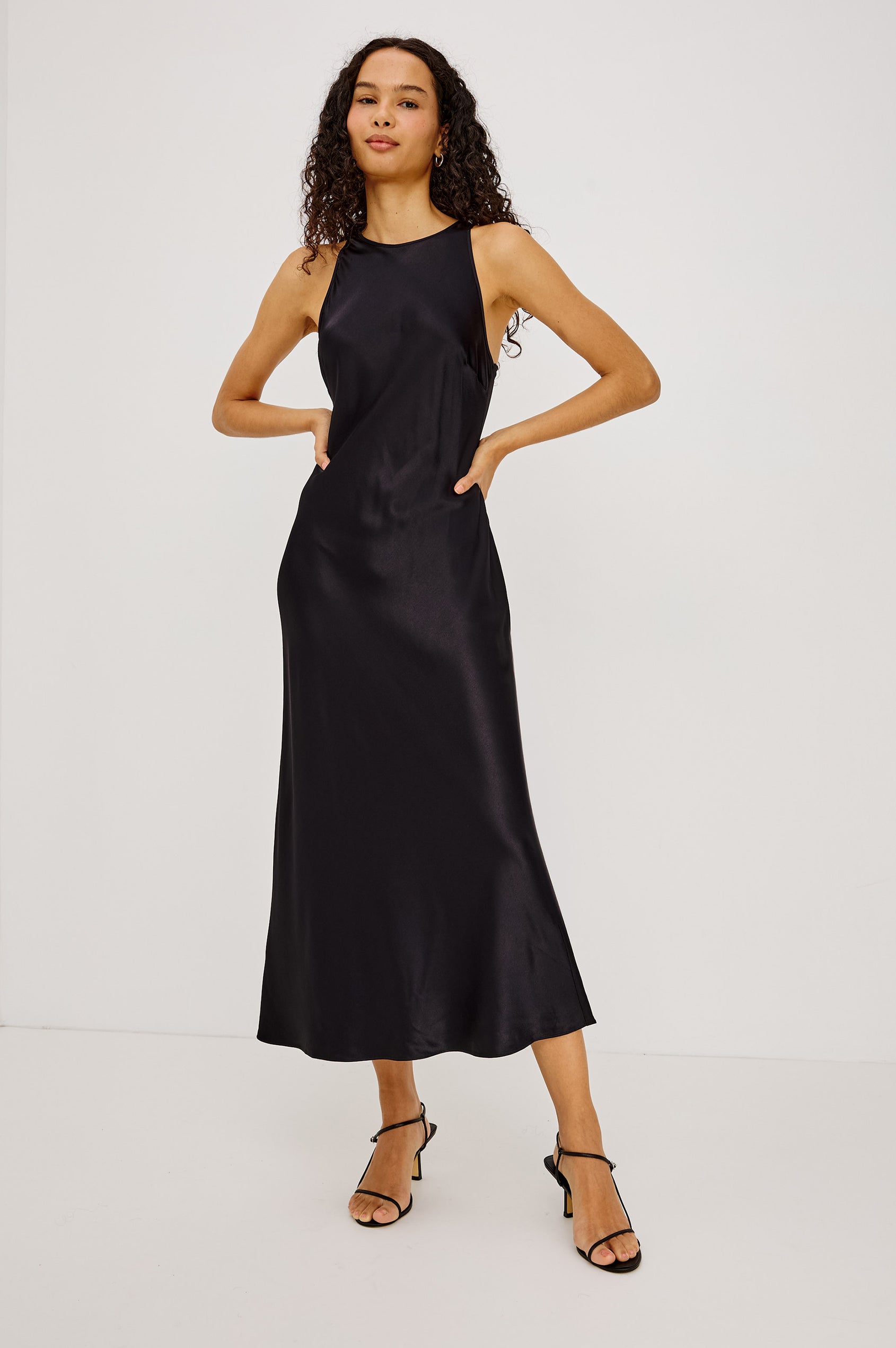 Solene Midi Dress in Satin-Back Crepe With Jewel Neck, and Back Keyhole With Self-Tie in Black Colorway - Full Body Front View Featured on Model