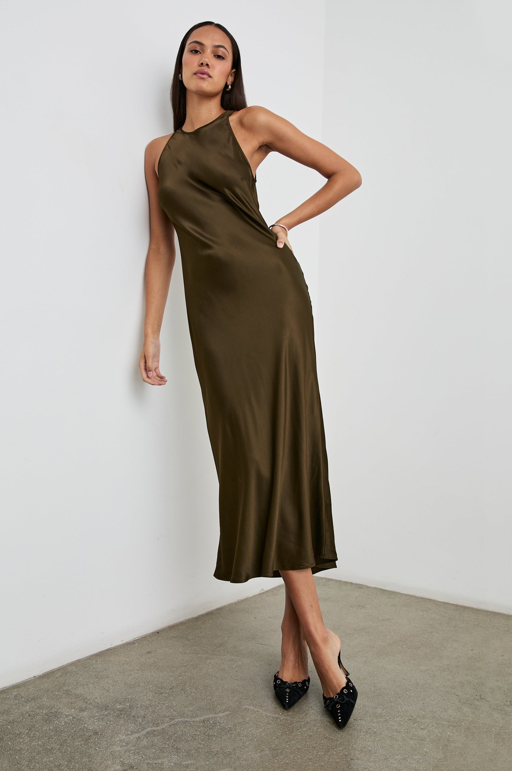 Solene Sleeveless Midi Dress with a Crew Neck and a Tie Keyhole at the Back in Dark Moss Colorway - Front Full Body View Featured on Model