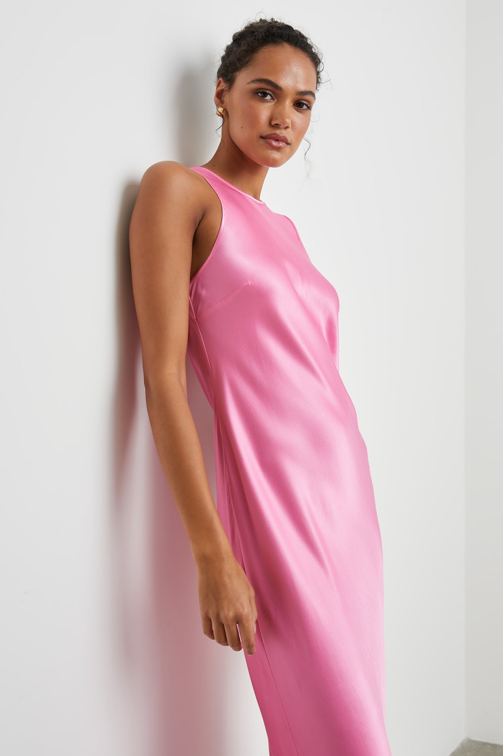 Solene Sleeveless Midi Dress with a Crew Neck and a Tie Keyhole at the Back in Malibu Pink Colorway - Side Full Body View Featured on Model