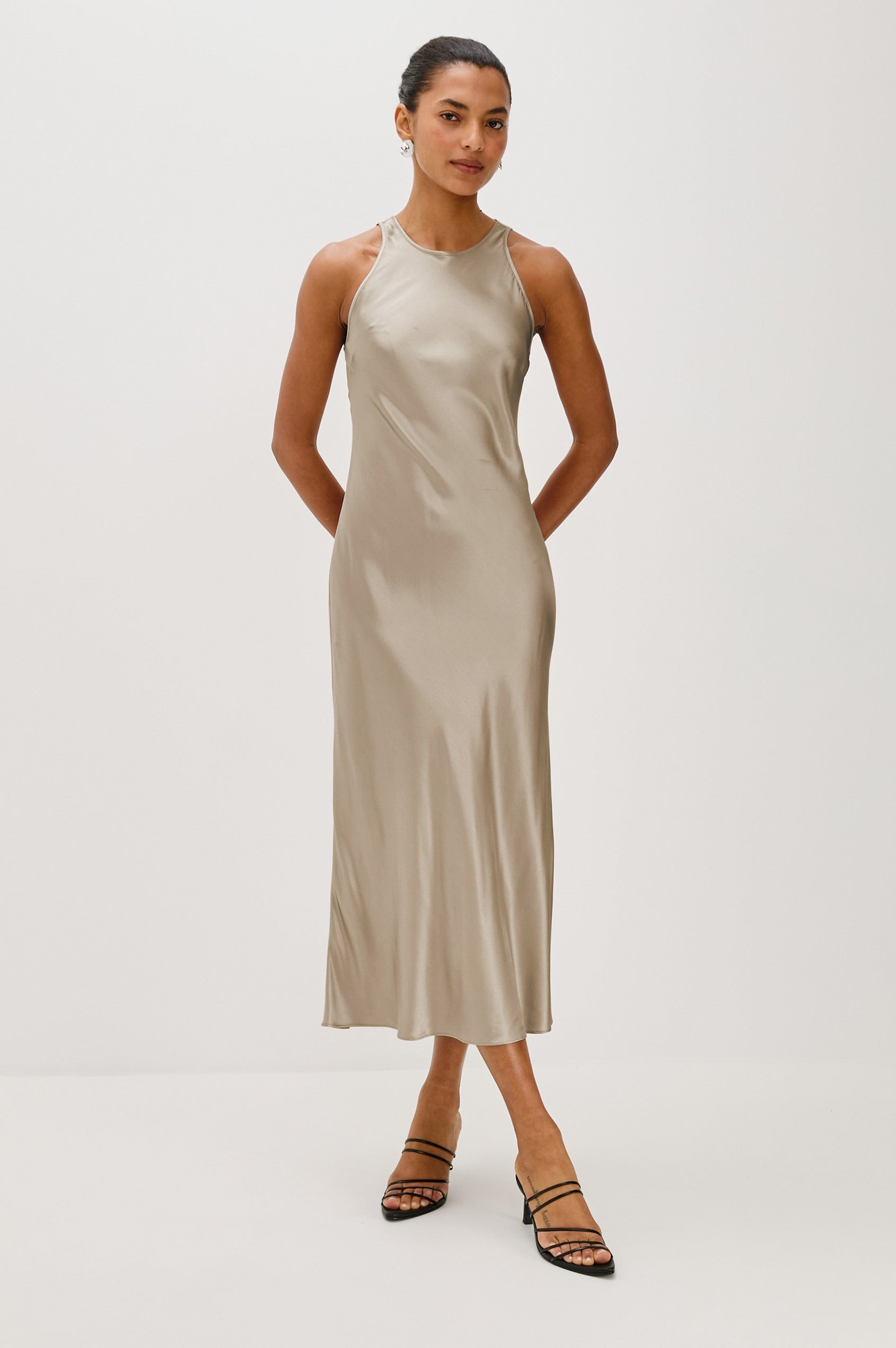 Solene Sleeveless Midi Dress with a Crew Neck and a Tie Keyhole at the Back in Mink Colorway - Front Full Body View Featured on Model