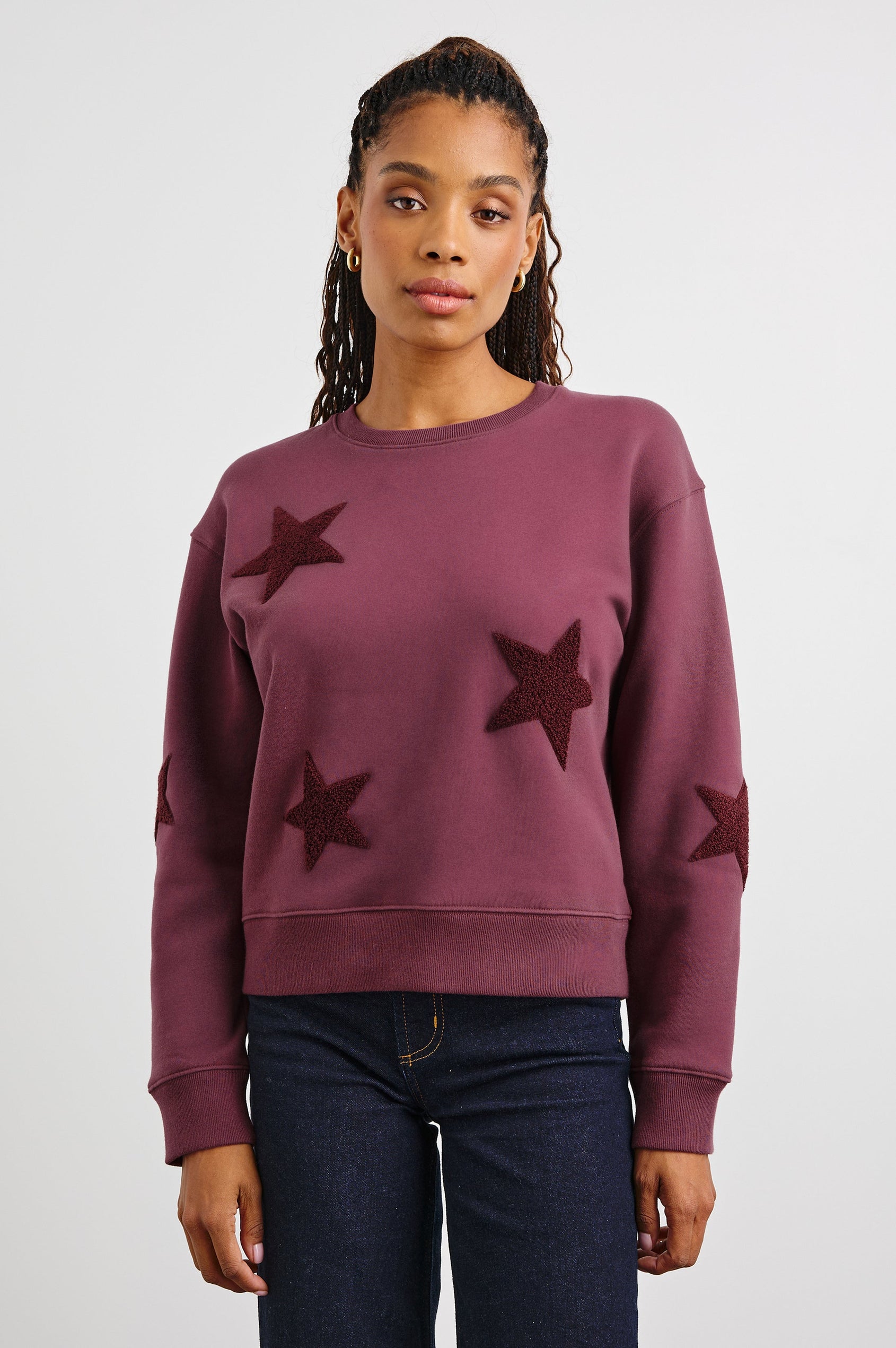 Sonia Long-Sleeve Sweatshirt with a Crew Neck and Patch Stars in Burgundy Colorway, with stars in a darker shade - Front View Featured on Model