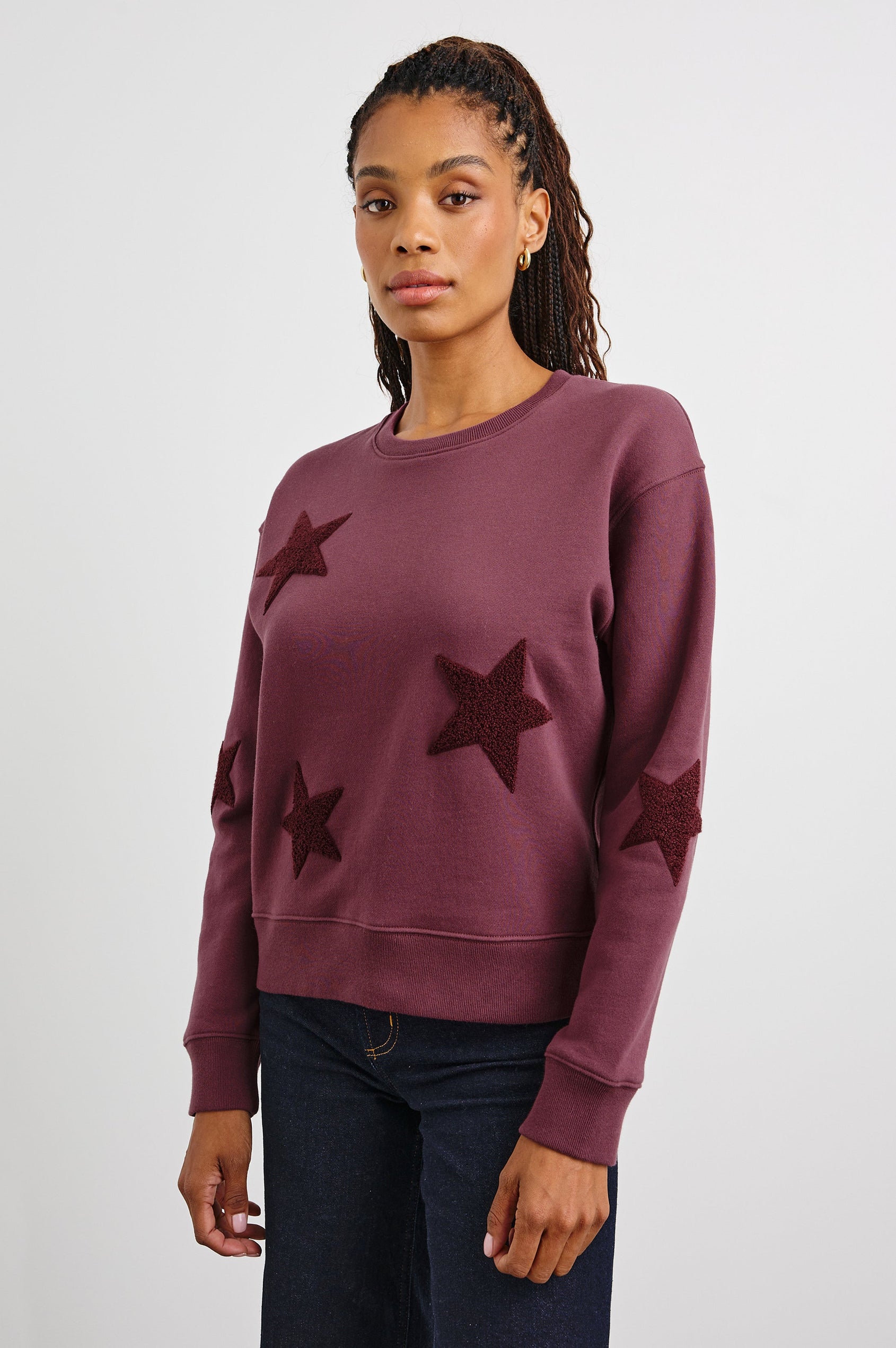 Sonia Long-Sleeve Sweatshirt with a Crew Neck and Patch Stars in Burgundy Colorway, with stars in a darker shade - Front View Featured on Model