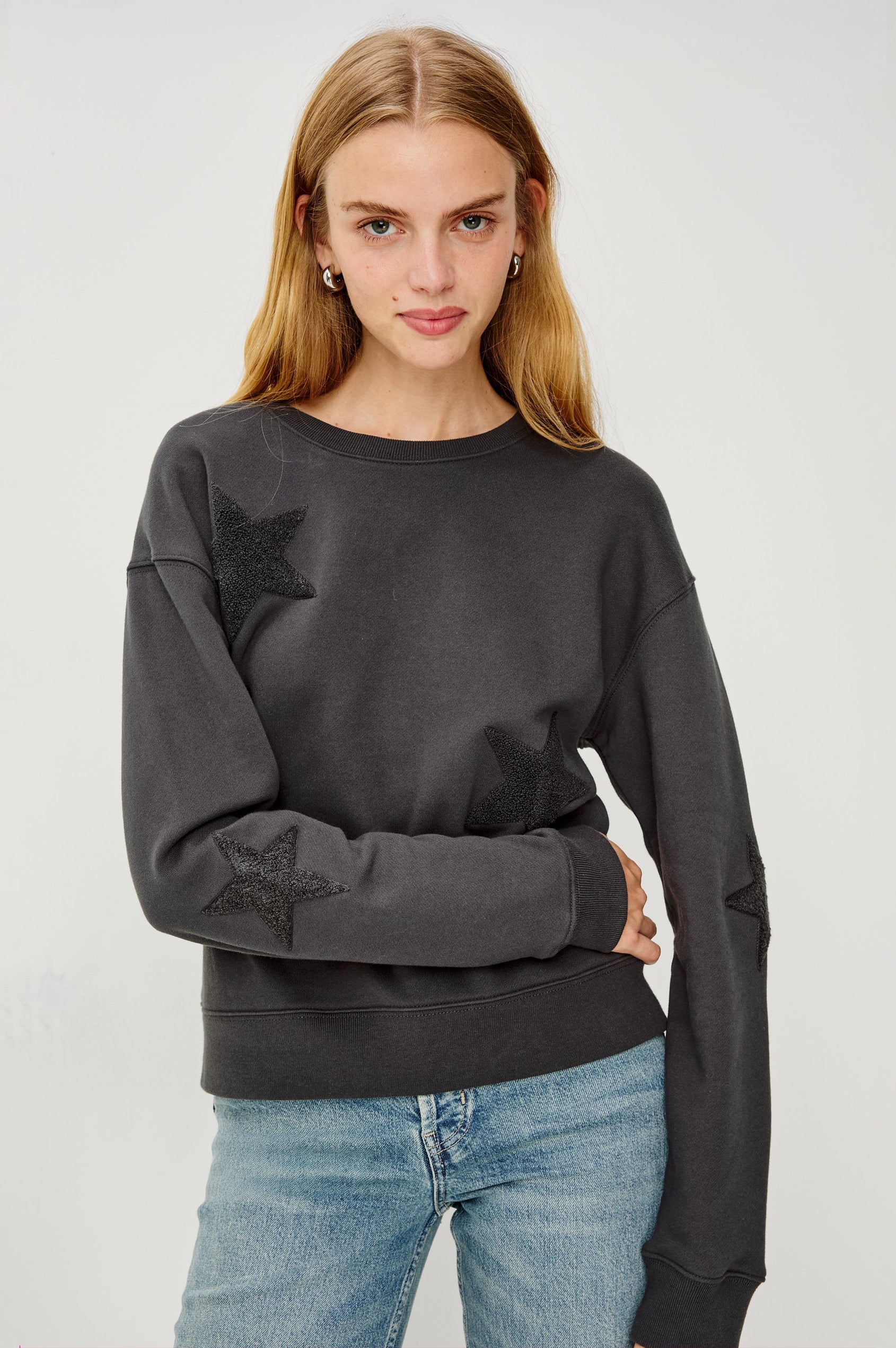 Sonia Long-Sleeve Sweatshirt with a Crew Neck and Charcoal Patch Stars in Washed Black Colorway - Front View Featured on Model