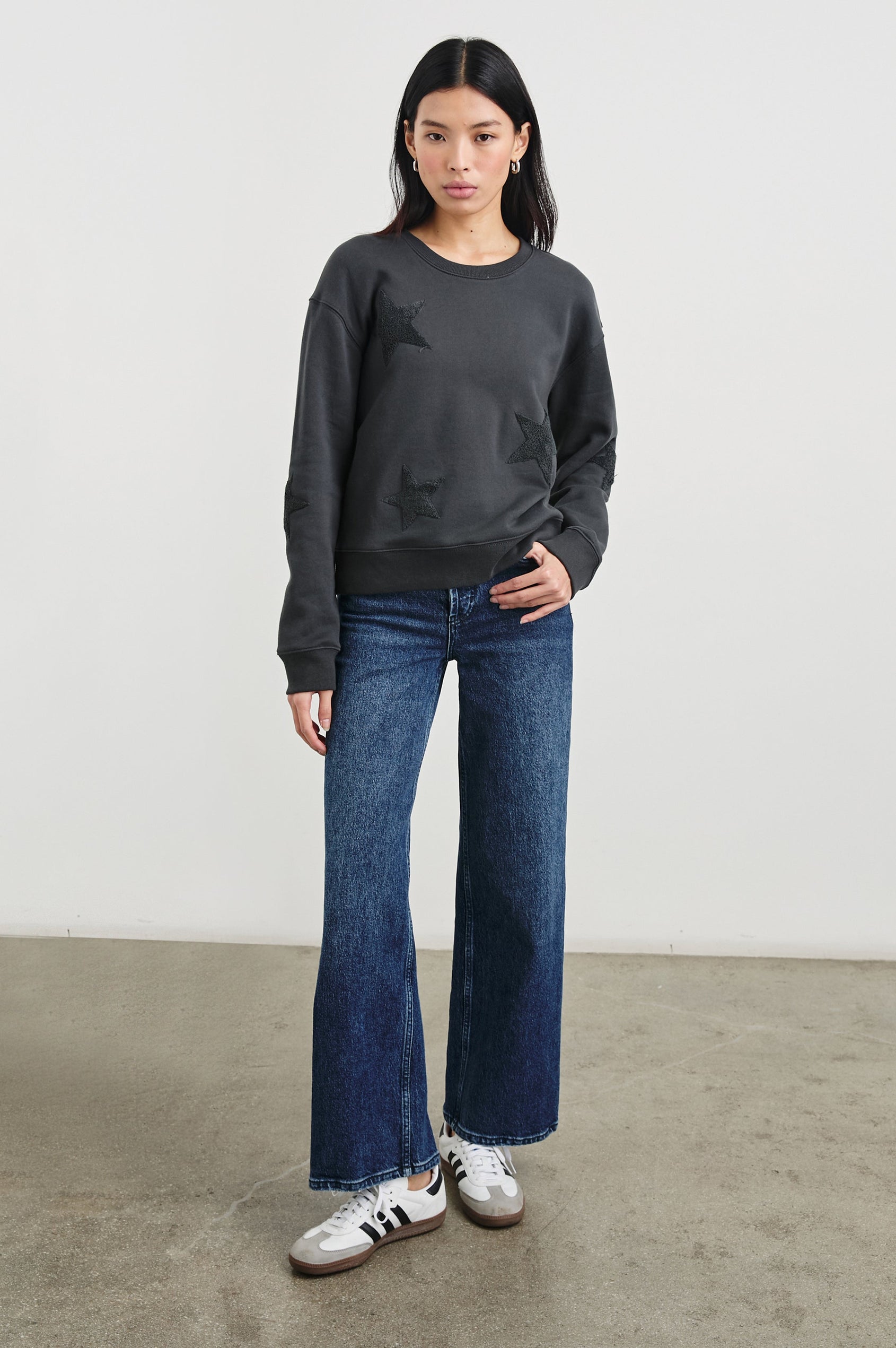 Sonia Long-Sleeve Sweatshirt with a Crew Neck and Charcoal Patch Stars in Washed Black Colorway - Front Full Body View Featured on Model