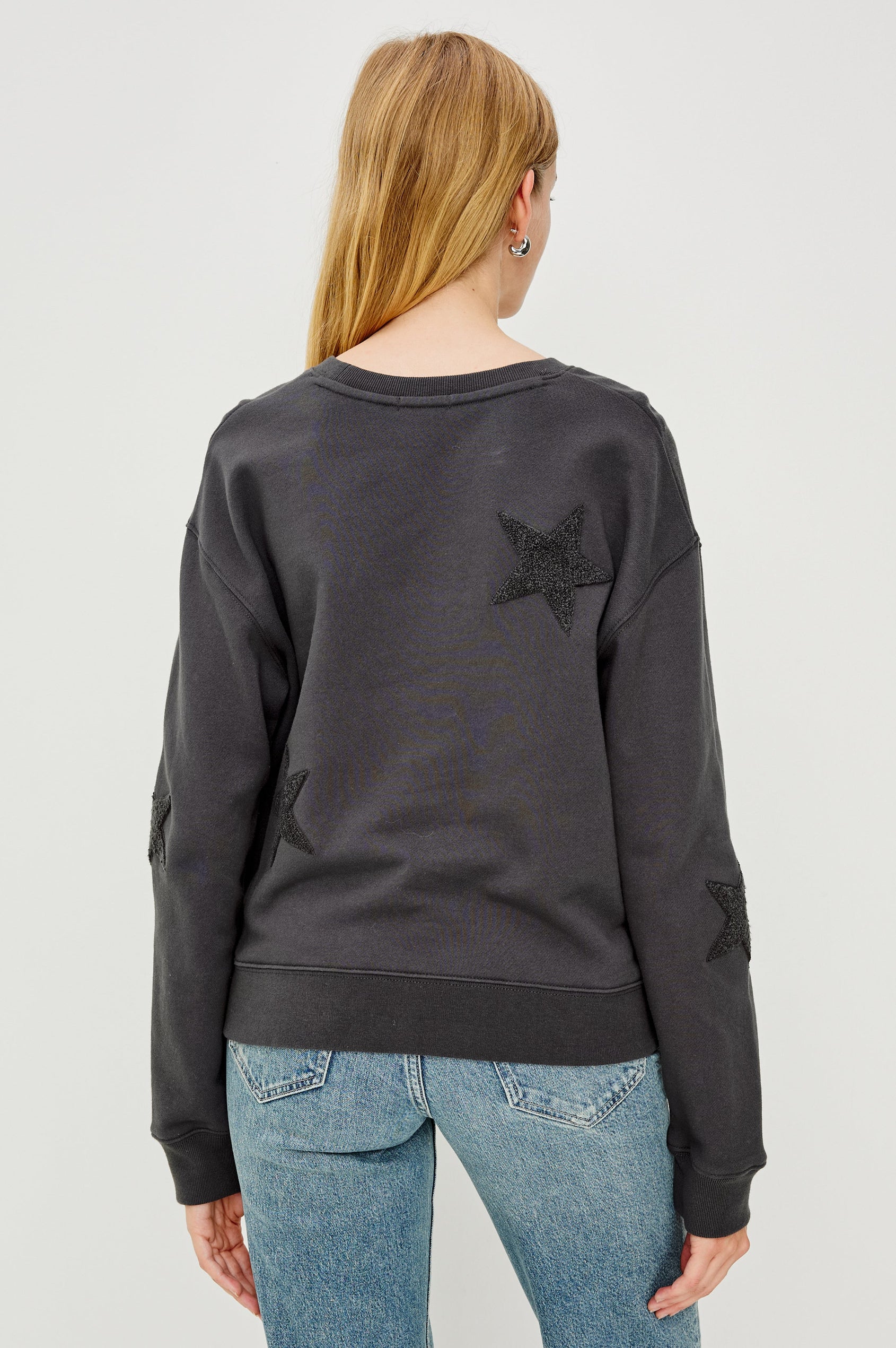 Sonia Long-Sleeve Sweatshirt with a Crew Neck and Charcoal Patch Stars in Washed Black Colorway - Back View Featured on Model