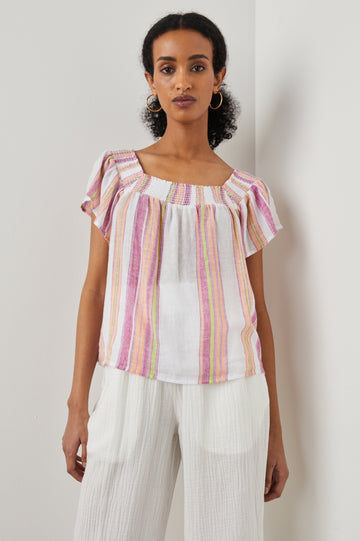 Sonora Short Sleeve Top with a Scoop Neckline and Shirring at the Neckline in Hibiscus Stripe Colorway, Vertical Stripes in Green, Orange, Pink and White - Front View Featured on Model 