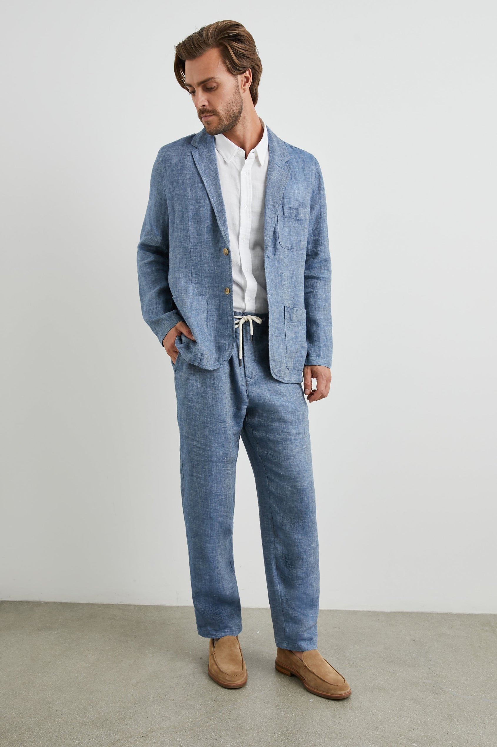 Mercer Pants with a Button and Drawcord Waist, Belt Loops, Two Front Pockets and Two Back Button Welt Pockets in Blue Mirage Colorway - Front Full Body View Featured on Model