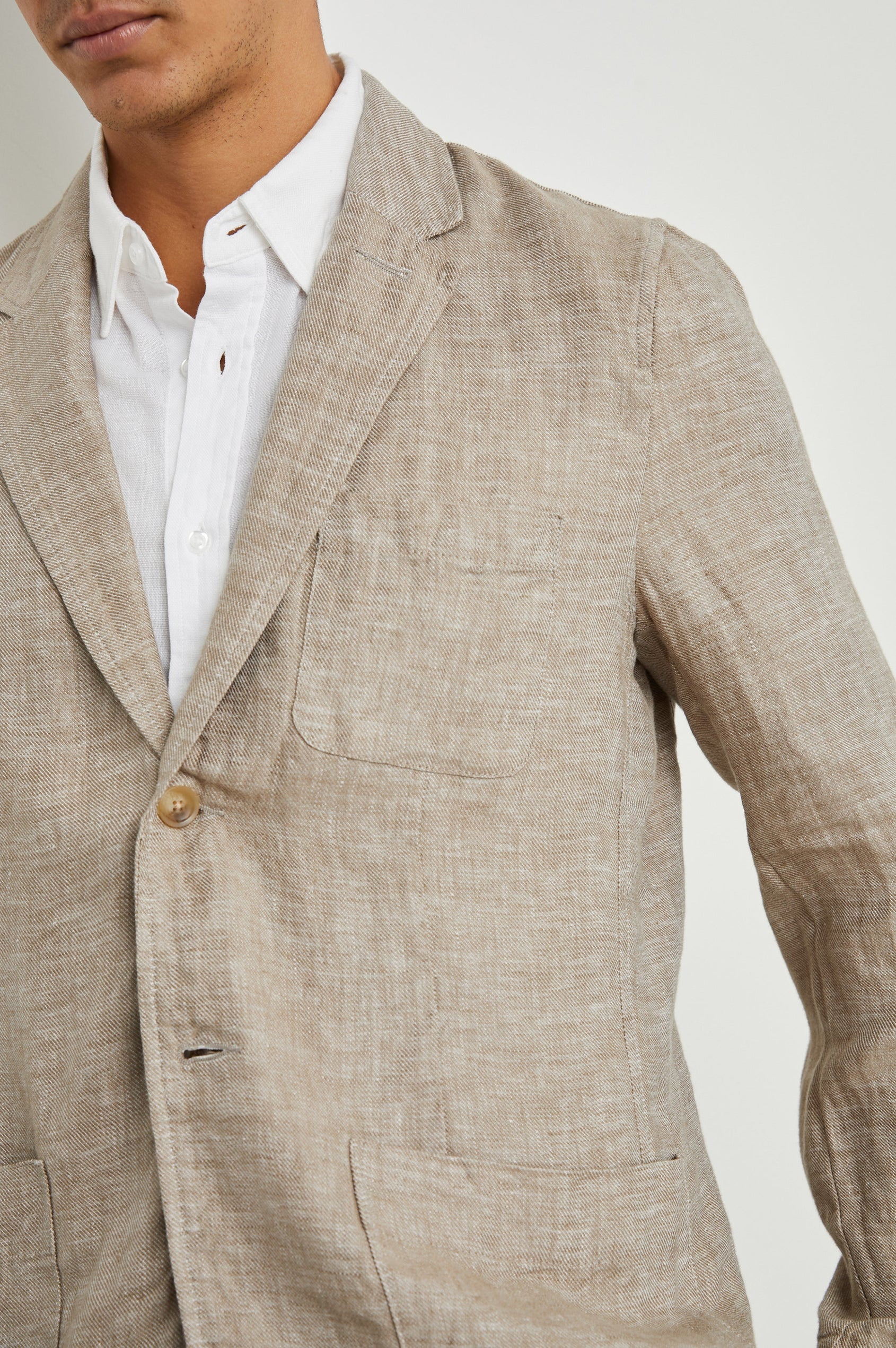 Sorrento Blazer with Two Button Closure, Two Front Flap Pockets, a Chest Patch Pocket and Three-Button Cuffs in Bulgur Colorway - Front View Featured on Model