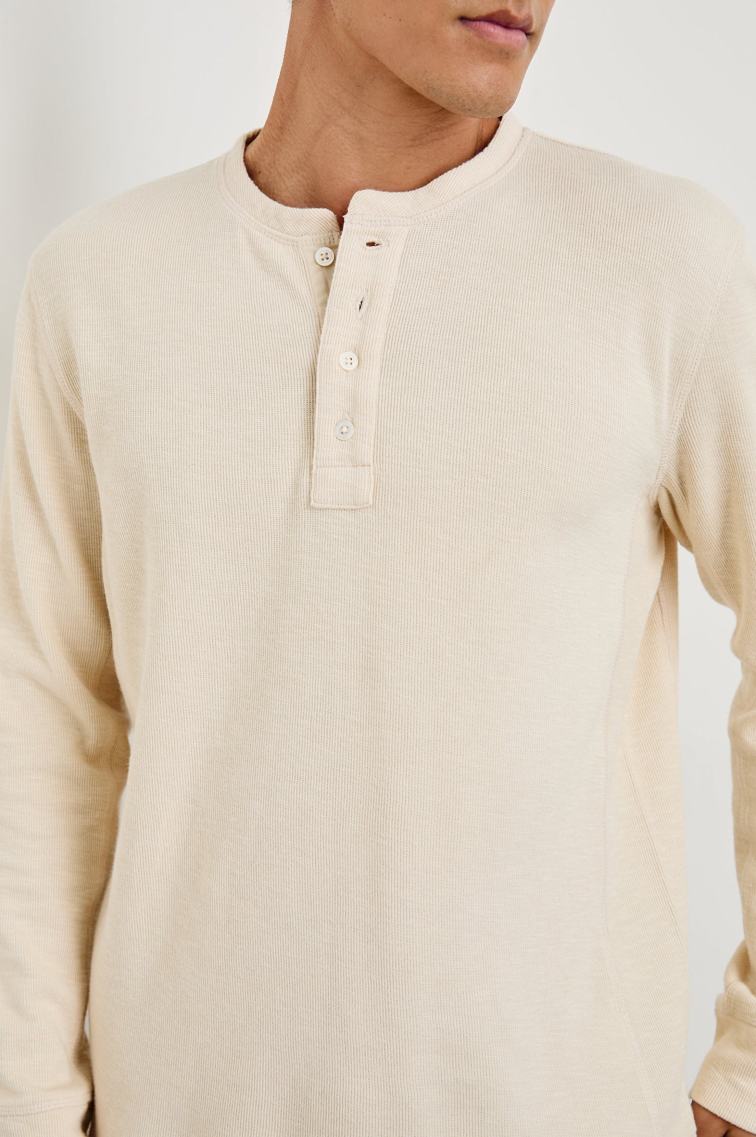 Soto Long-Sleeve Henley with a Four Button Placket and a Crew Neck in Bone Colorway - Front View Featured on Model