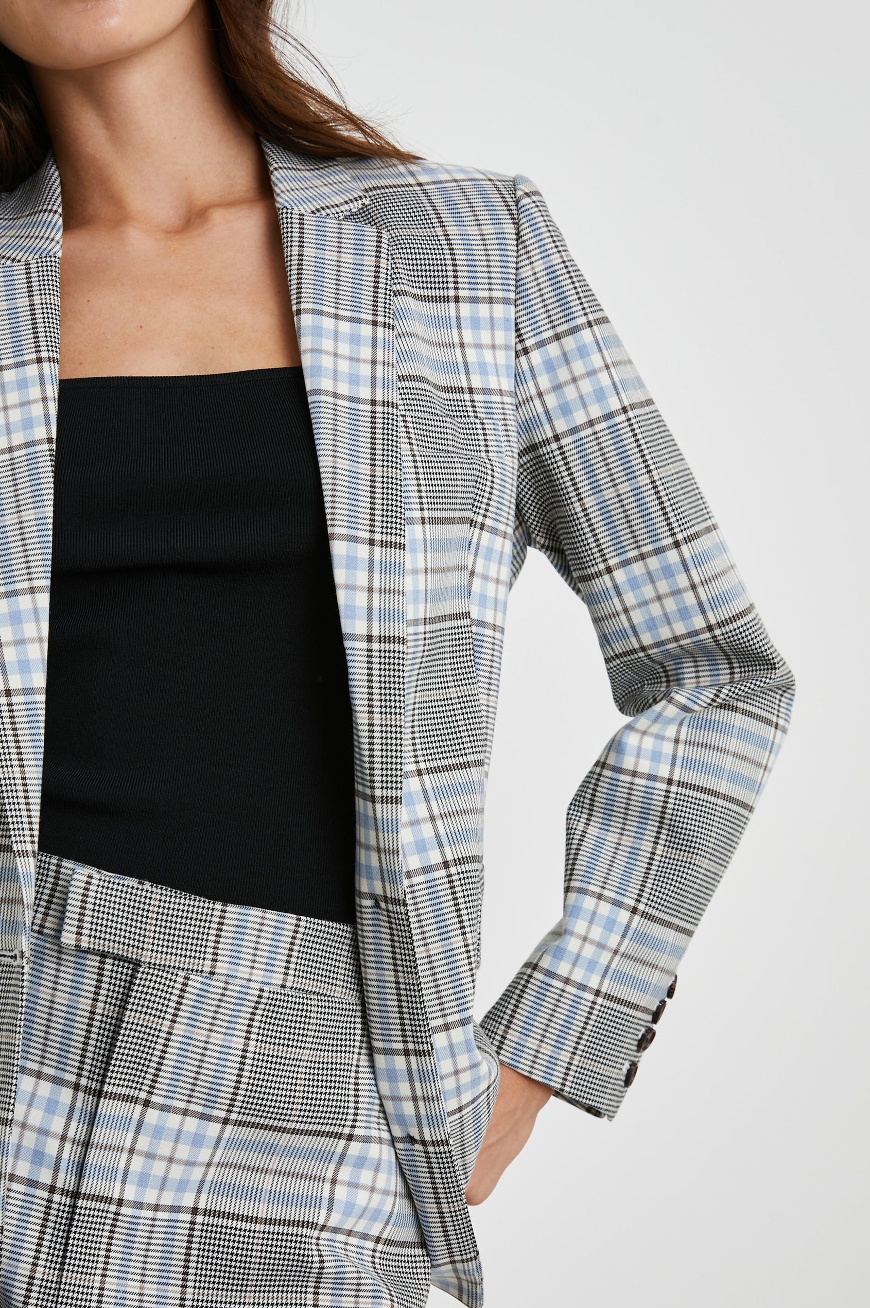 Stanton Blazer with Two Button Closure, Two Front Flap Pockets, a Chest Patch Pocket and Four-Button Cuffs in Cocoa Sky Check Colorway, a Grey, Blue and White Plaid - Front View Featured on Model