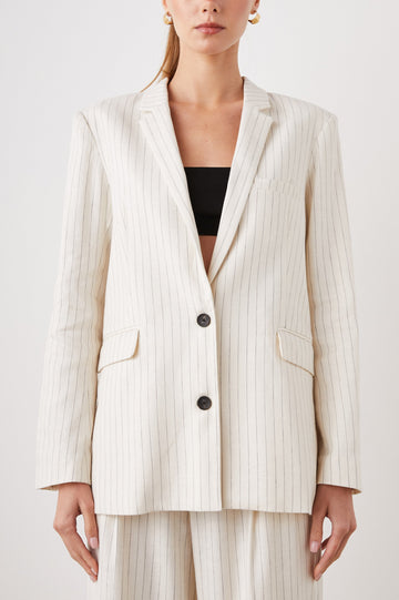 Stanton Blazer with Two Button Closure, Two Front Flap Pockets, a Chest Patch Pocket and Four-Button Cuffs in Ivory Pinstripe Colorway - Front View Featured on Model