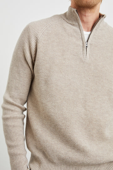 Stark Long-Sleeve  Quarter Zip with a Mock Neck, Waffle Torso, and Ribbed Sleeves in Oat Melange Colorway - Front View Featured on Model