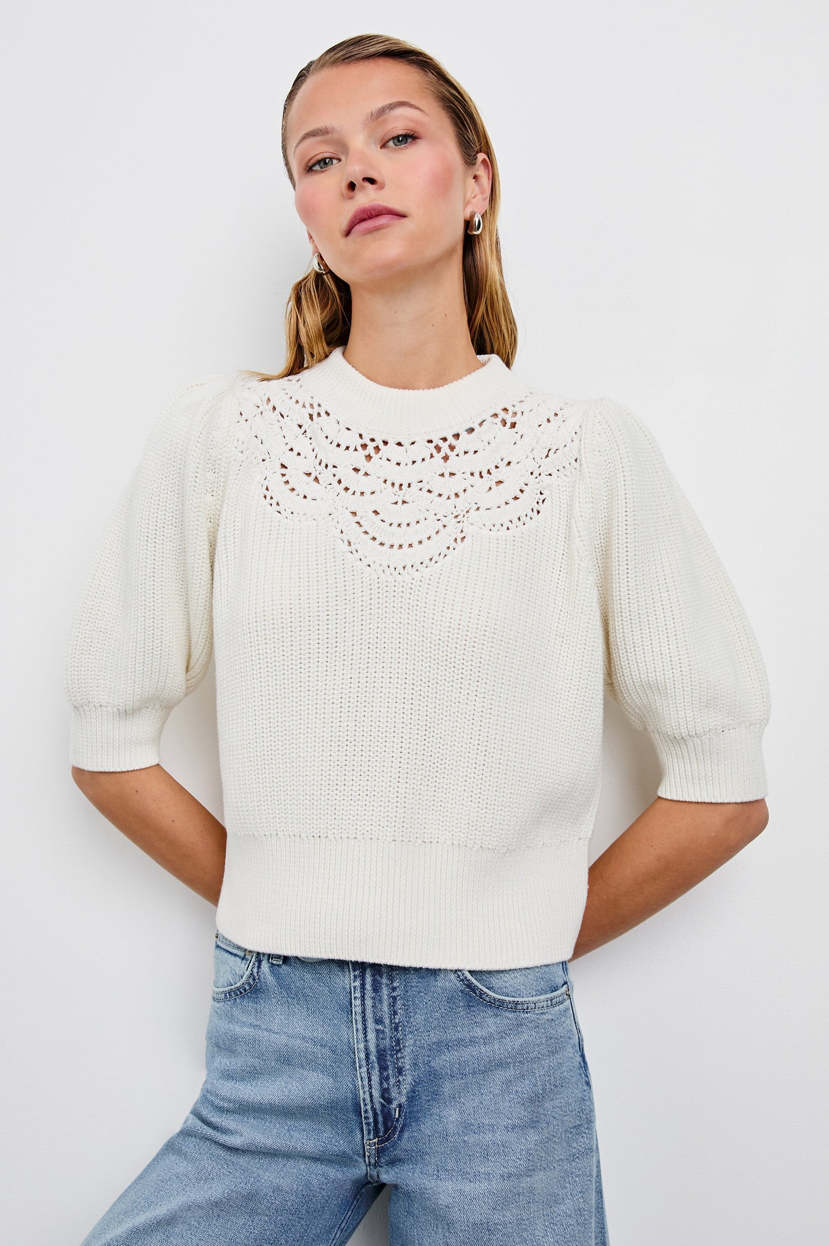 Steph Sweater with Elbow Length Sleeves, Ribbed Trims, a Crew Neck and Crochet on the Upper Chest in White Colorway - Front View Featured on Model