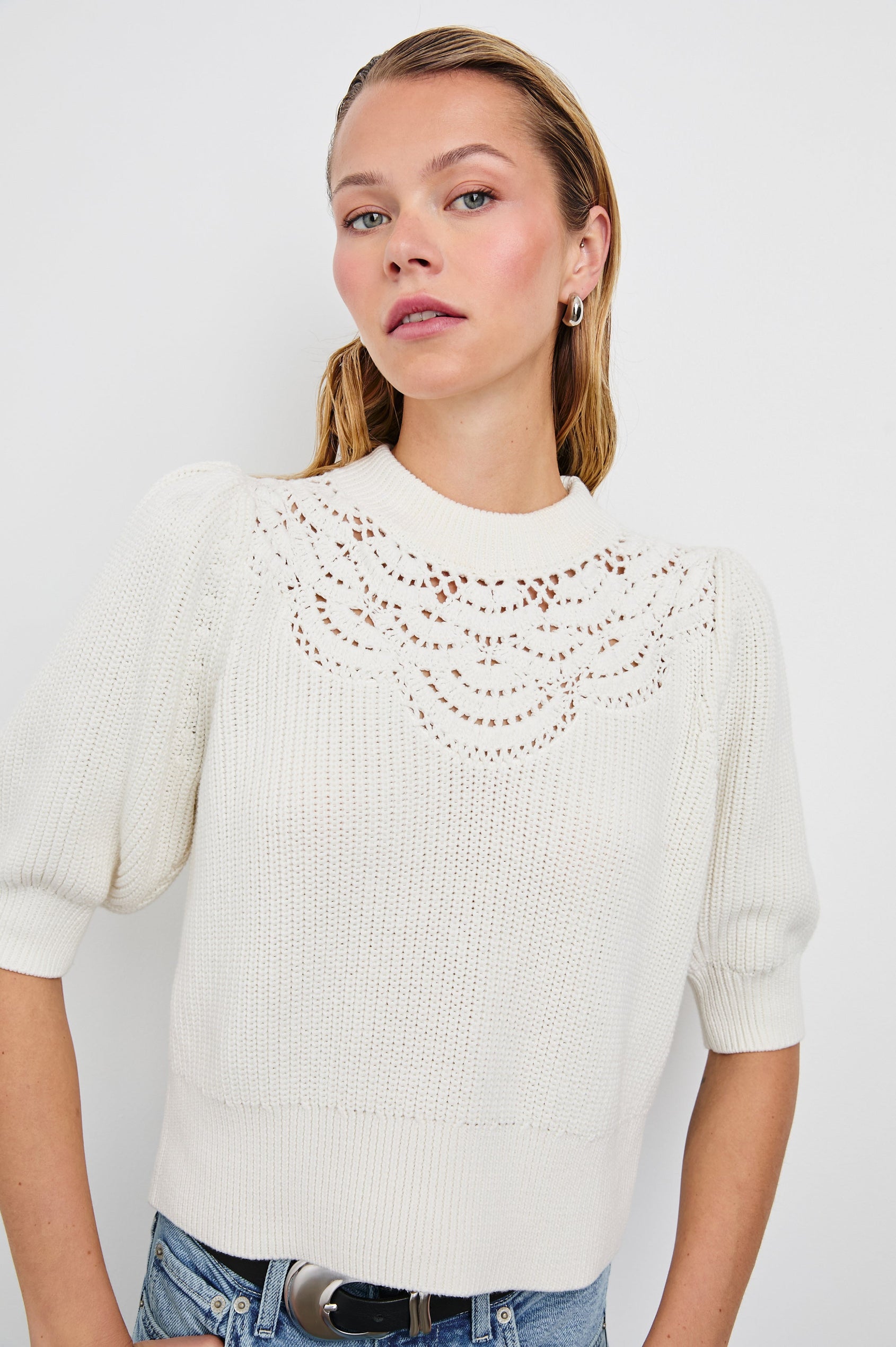 Steph Sweater with Elbow Length Sleeves, Ribbed Trims, a Crew Neck and Crochet on the Upper Chest in White Colorway - Front View Featured on Model