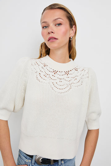 Steph Sweater with Elbow Length Sleeves, Ribbed Trims, a Crew Neck and Crochet on the Upper Chest in White Colorway - Front View Featured on Model