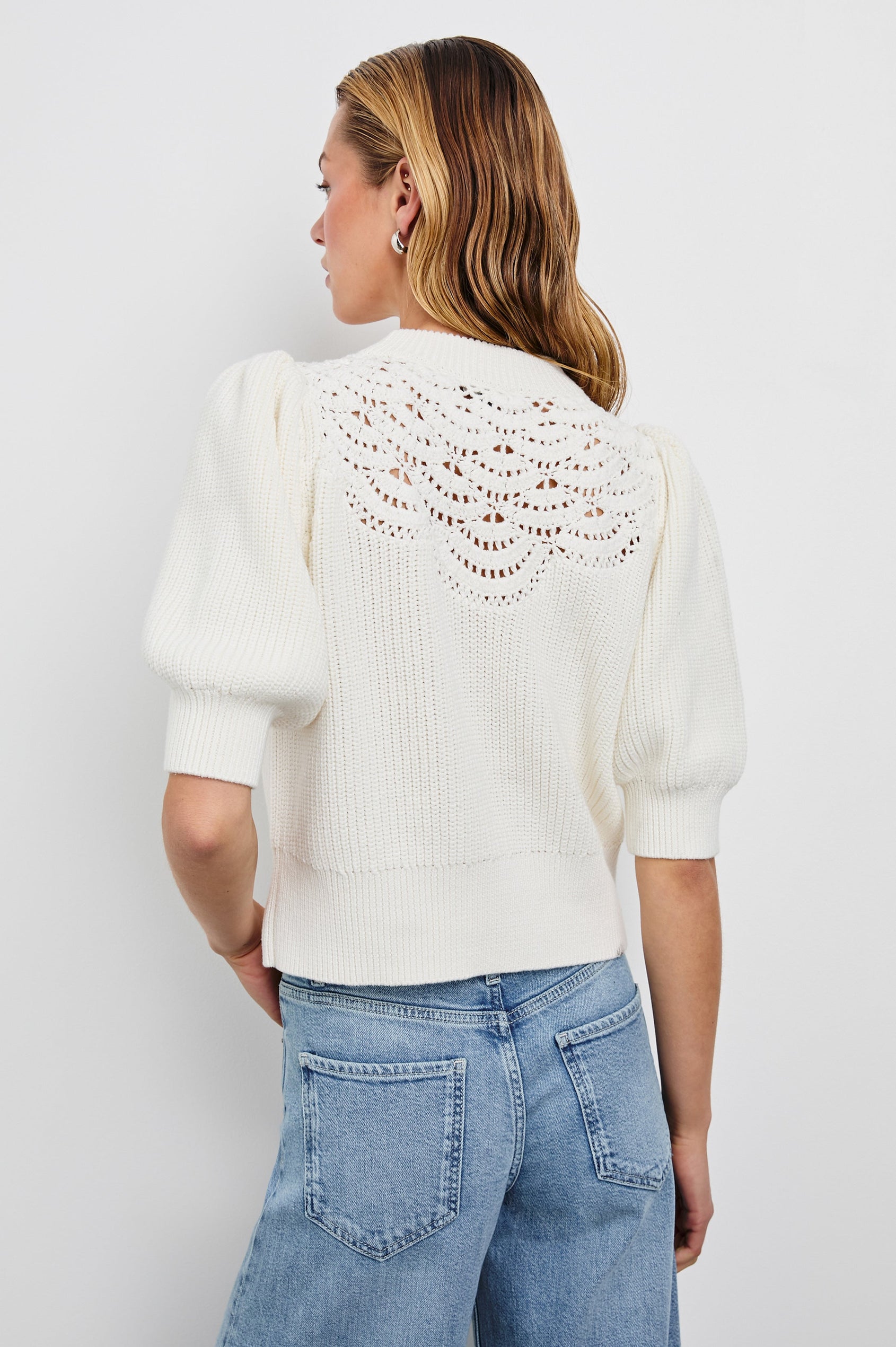 Steph Sweater with Elbow Length Sleeves, Ribbed Trims, a Crew Neck and Crochet on the Upper Chest in White Colorway - Back View Featured on Model