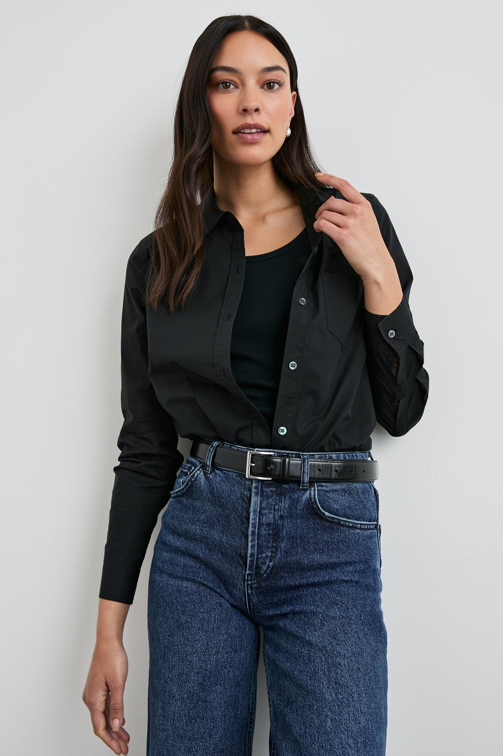 Stina Long-Sleeve Button Up with a Chest Patch Pocket in Black Colorway - Front Tucked View Featured on Model