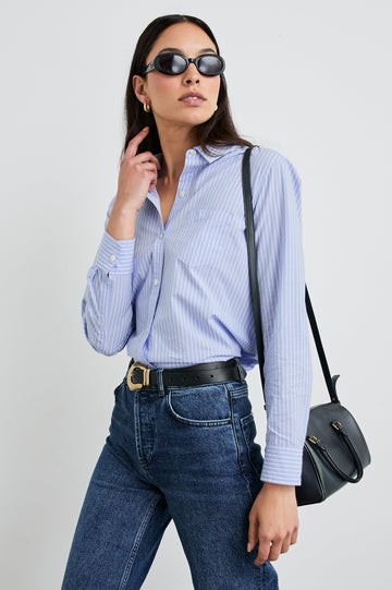 Stina Long-Sleeve Button Up with a Chest Patch Pocket in Oxford White Stripe Colorway, Thin White Vertical Stripes on Blue - Front Tucked View Featured on Model