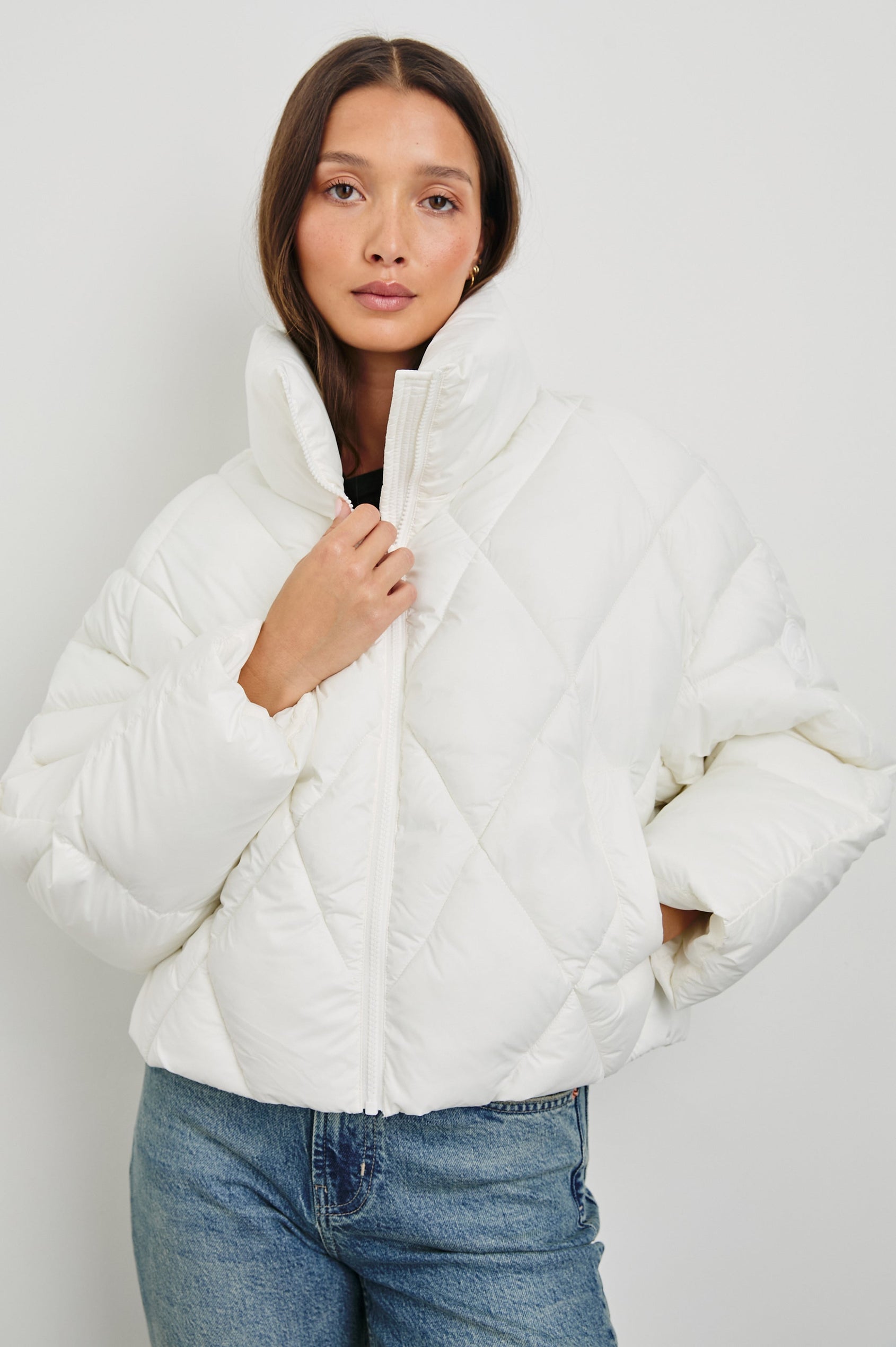 Summit Cropped Puffer Jacket with a Mid-Neck Collar, Two Pockets and a Rails Logo on the Arm in Ivory Colorway - Front View Featured on Model