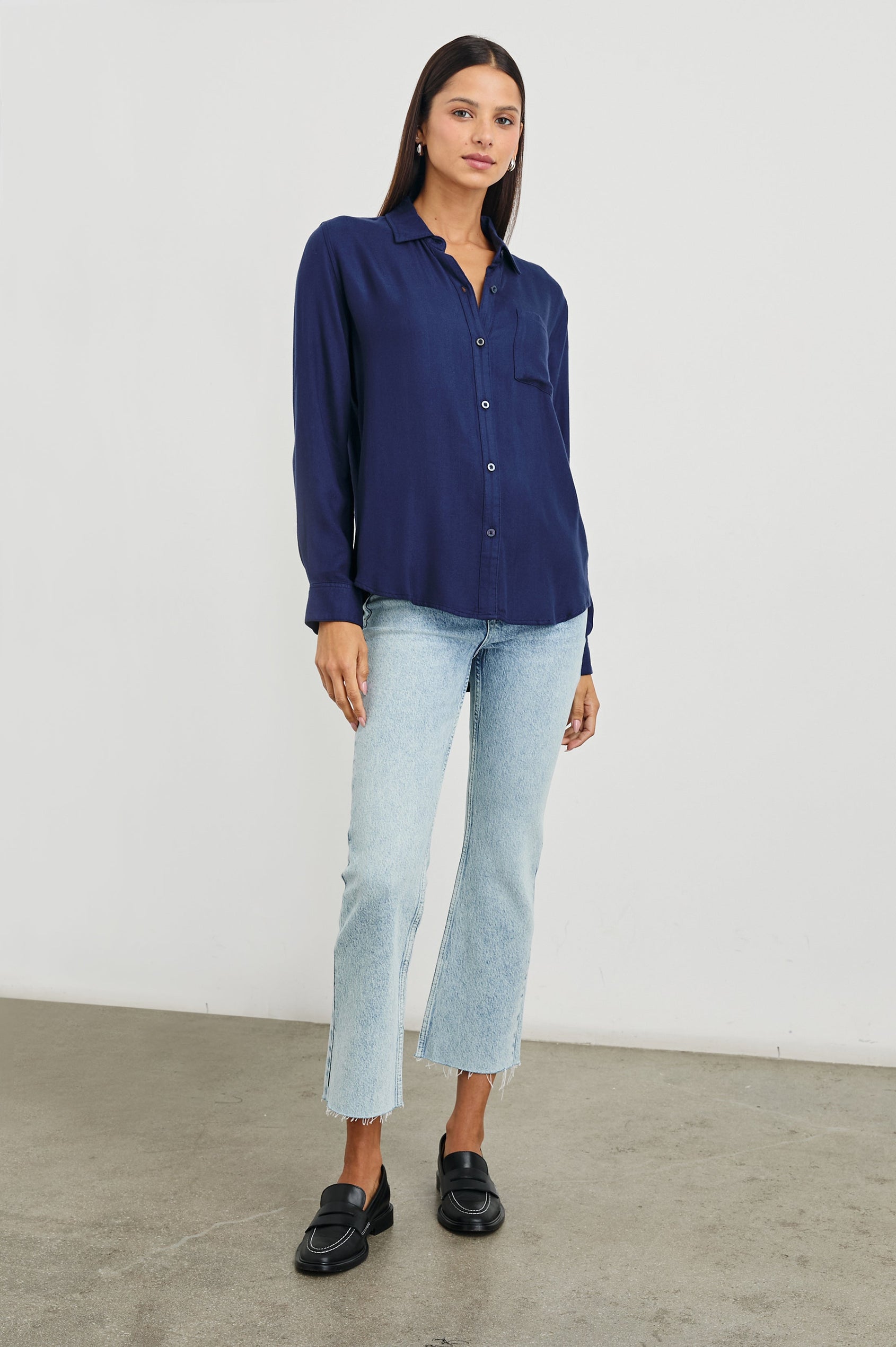 Sunset Crop Slim Fare Jeans with a Raw Hem, Belt Loops, Two Front Pockets plus a Coin Pocket and Two Back Patch Pockets in Snowbird Colorway - Front Full Body View Featured on Model