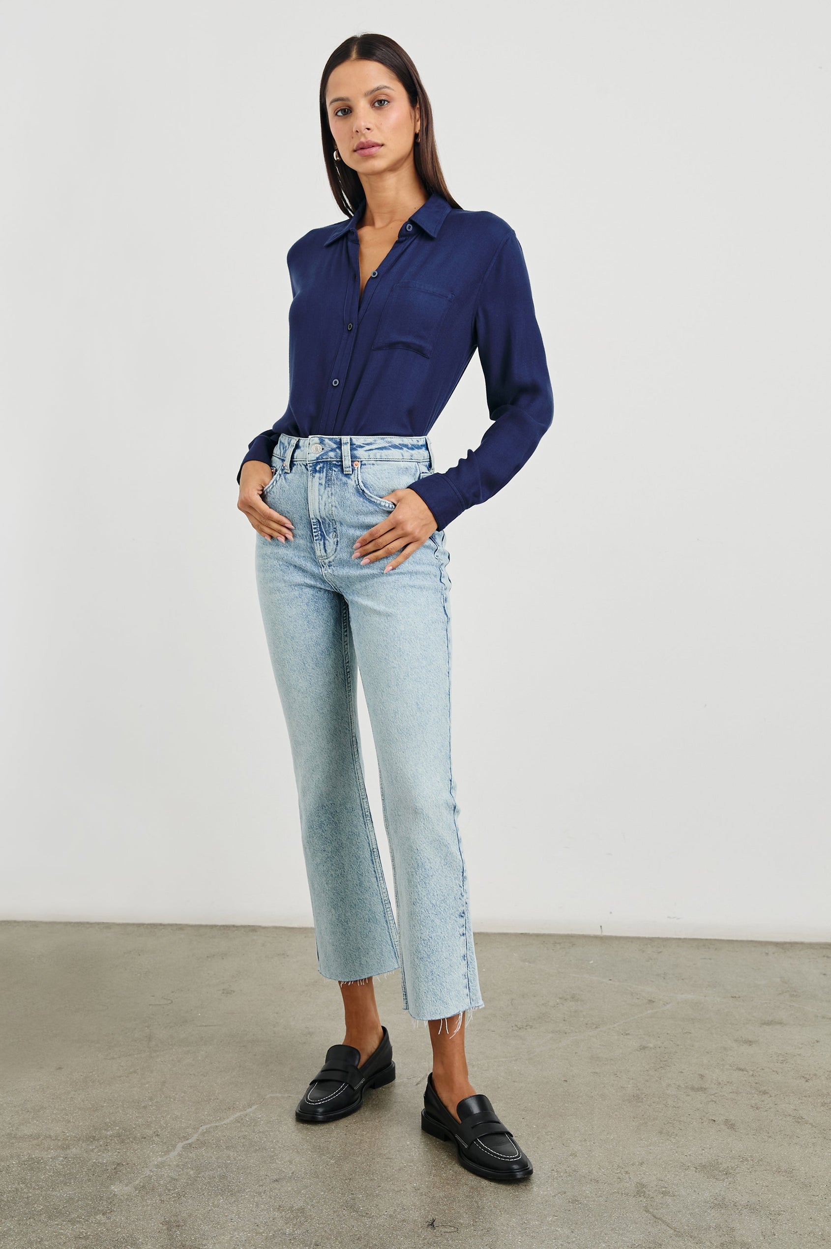 Sunset Crop Slim Fare Jeans with a Raw Hem, Belt Loops, Two Front Pockets plus a Coin Pocket and Two Back Patch Pockets in Snowbird Colorway - Front Full Body View Featured on Model