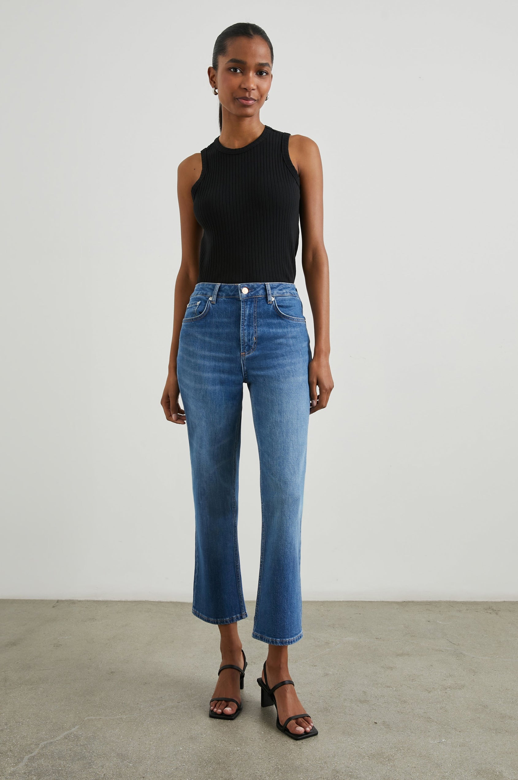 Sunset Crop Slim Fare Jeans with Belt Loops, Two Front Pockets plus a Coin Pocket and Two Back Patch Pockets in Tidal Wave Colorway - Front Full Body View Featured on Model