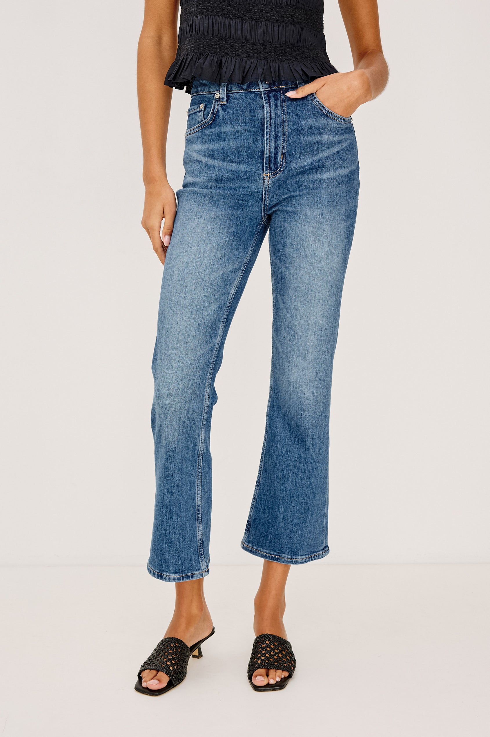 Sunset Crop Slim Flare Jean in Light Stretch Denim With High-Waisted Fit and Zip Fly in Tidal Wave Colorway - Lower Body Front View Featured on Model