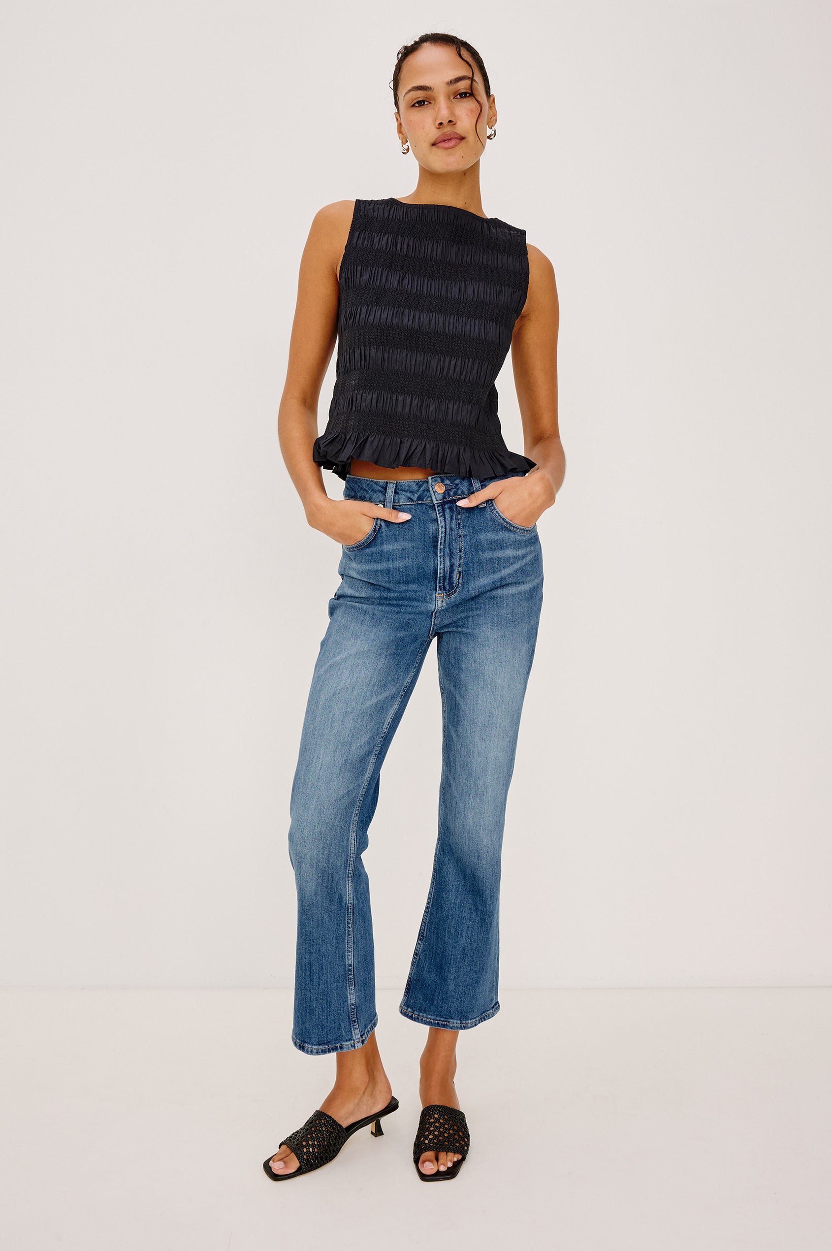 Sunset Crop Slim Flare Jean in Light Stretch Denim With High-Waisted Fit and Zip Fly in Tidal Wavey Colorway - Lower Body Front View Featured on Model