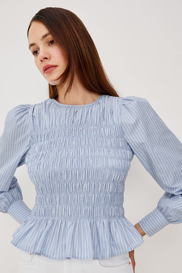 Tabi Blouse Top in Poplin With Smocked Body, Long Puff Sleeves With Fitted Cuffs, Contrast Embroidered Detailing, and Back Keyhole Cutout in White Stripe Colorway - Upper Body Front View Featured on Model