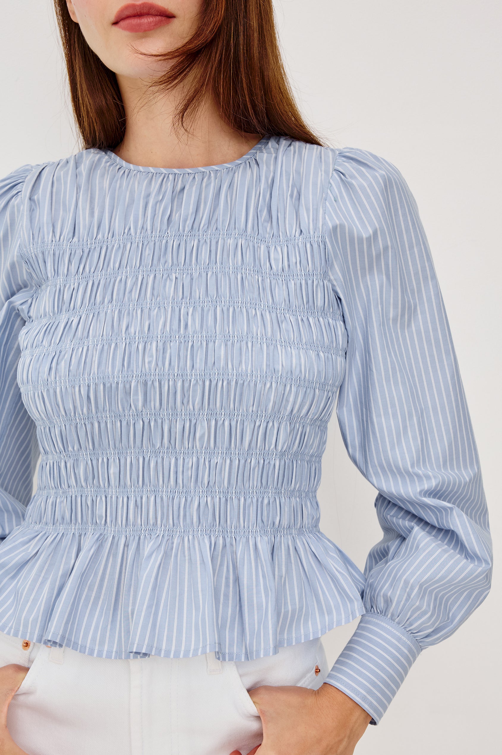 Tabi Blouse Top in Poplin With Smocked Body, Long Puff Sleeves With Fitted Cuffs, Contrast Embroidered Detailing, and Back Keyhole Cutout in White Stripe Colorway - Upper Body Front View Featured on Model