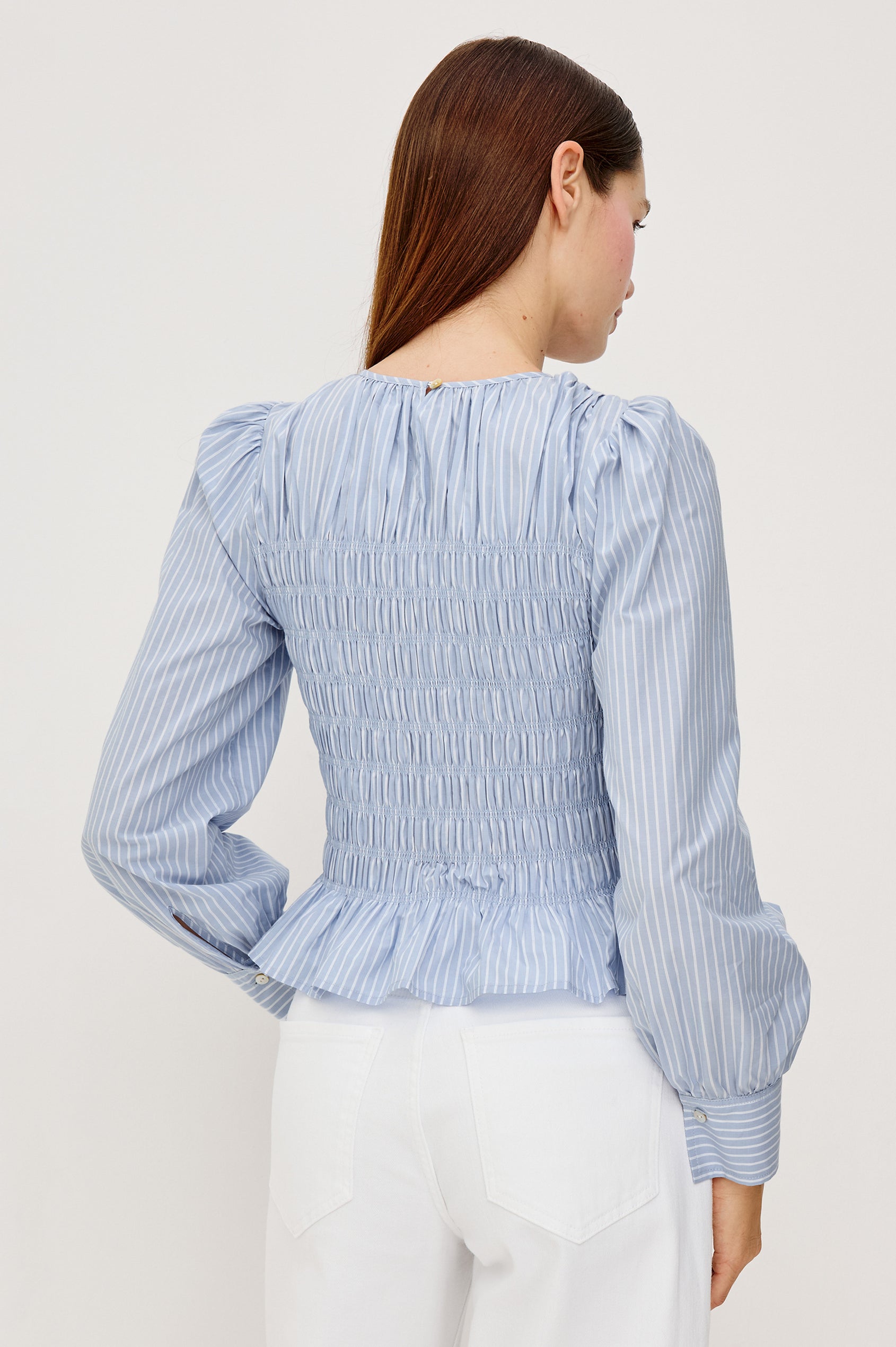 Tabi Blouse Top in Poplin With Smocked Body Long Puff Sleeves With Fitted Cuffs Contrast Embroidered Detailing and Back Keyhole Cutout in White Stripe Colorway - Upper Body Back View Featured on Model