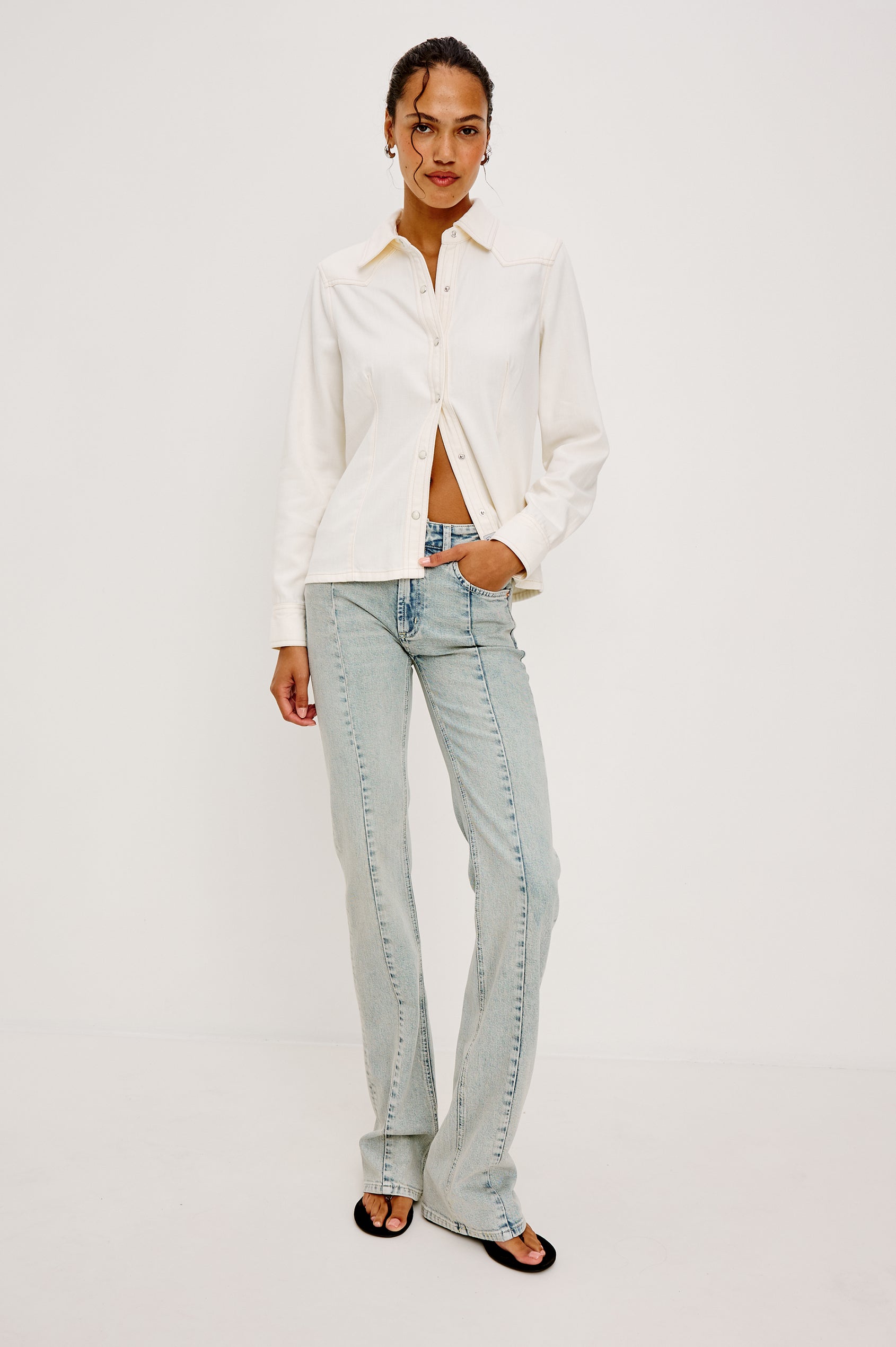 Taiana Shirt in Cotton Lyocell Denim With Collar Front and Back Darting Western Yoke Front Snap Buttons Long Sleeves and Fitted Silhouette in Ivory Colorway - Full Body Front View Featured on Model