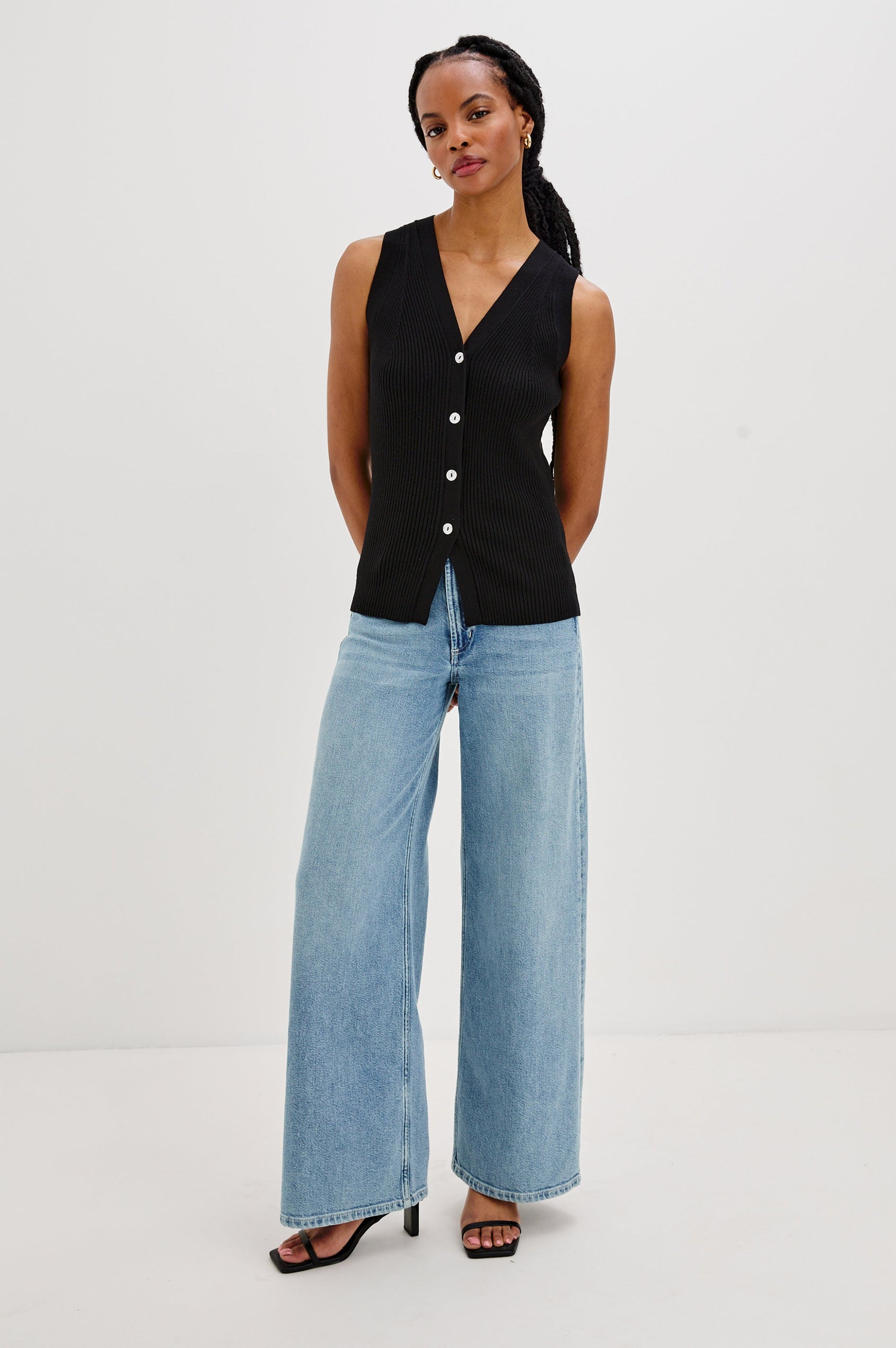 Tatia V-Neck Button Front Vest in Black Colorway. Front View Shown on Model.