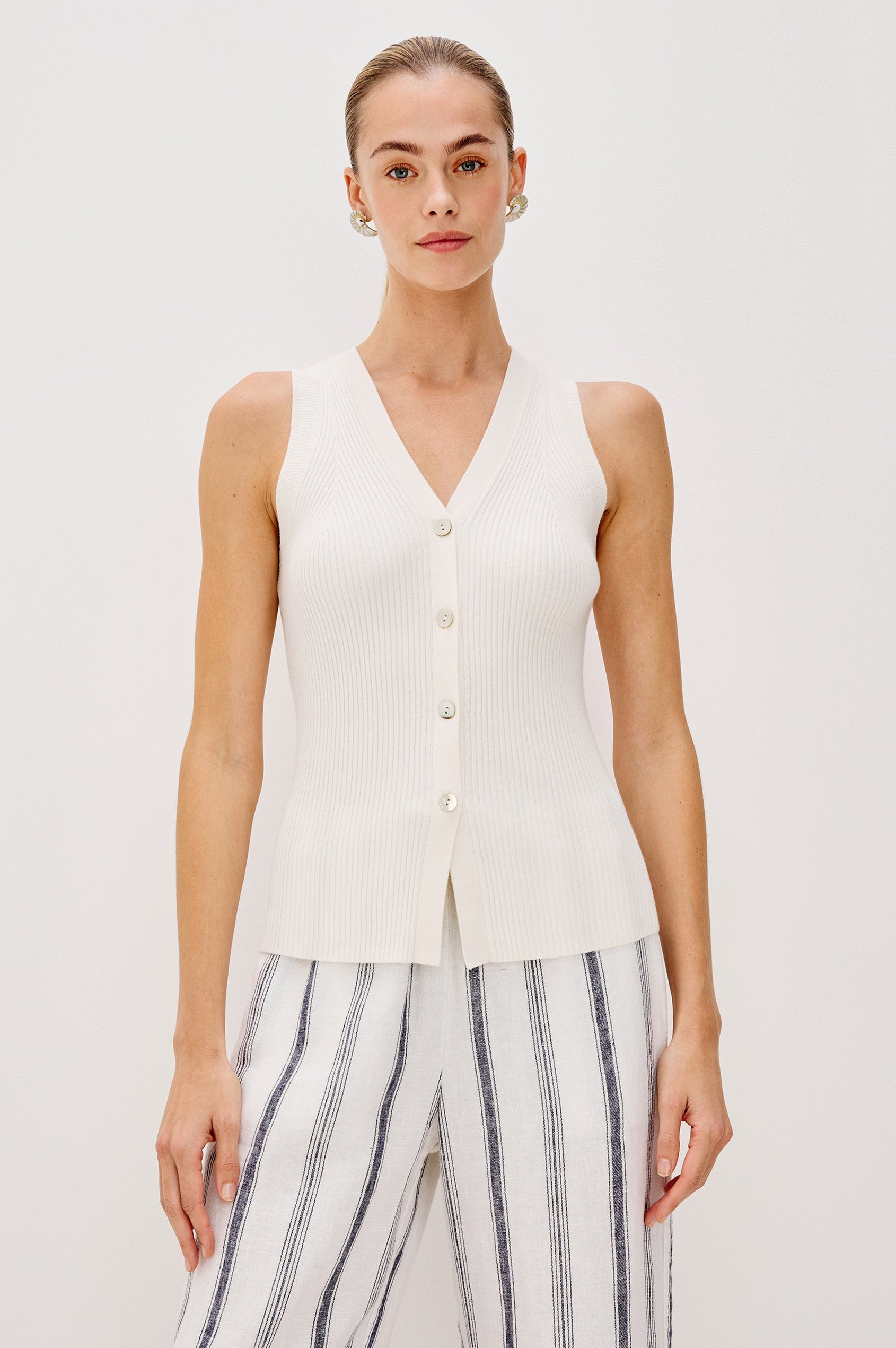 Tatia V-Neck Button Front Vest in Ecru Colorway. Front View Shown on Model.