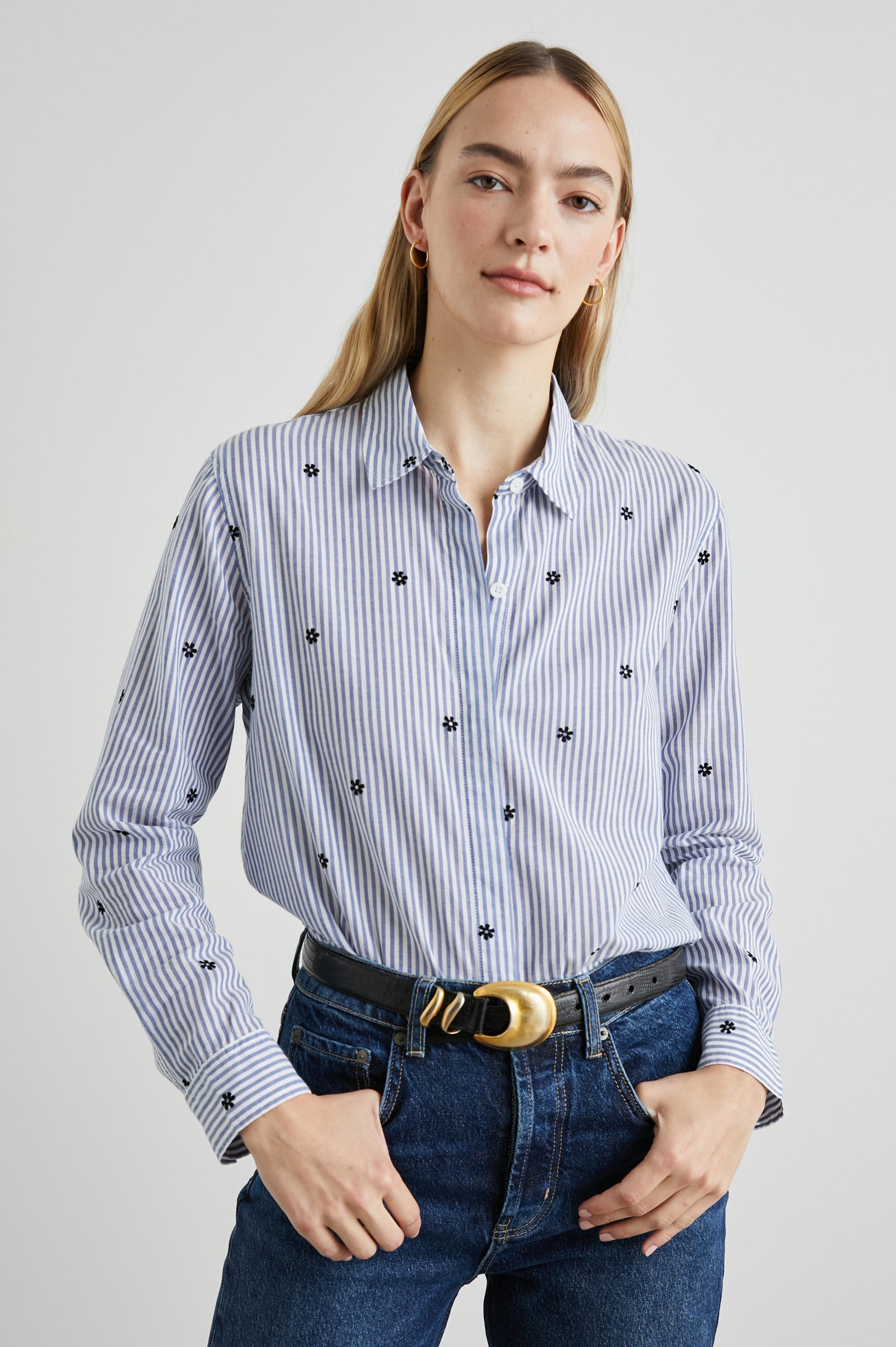 Taylor Long-Sleeve Button Up with Small Dark Navy Daisies in Flocked Daisies Colorway, with Blue and White Vertical Stripes - Front Tucked View Featured on Model