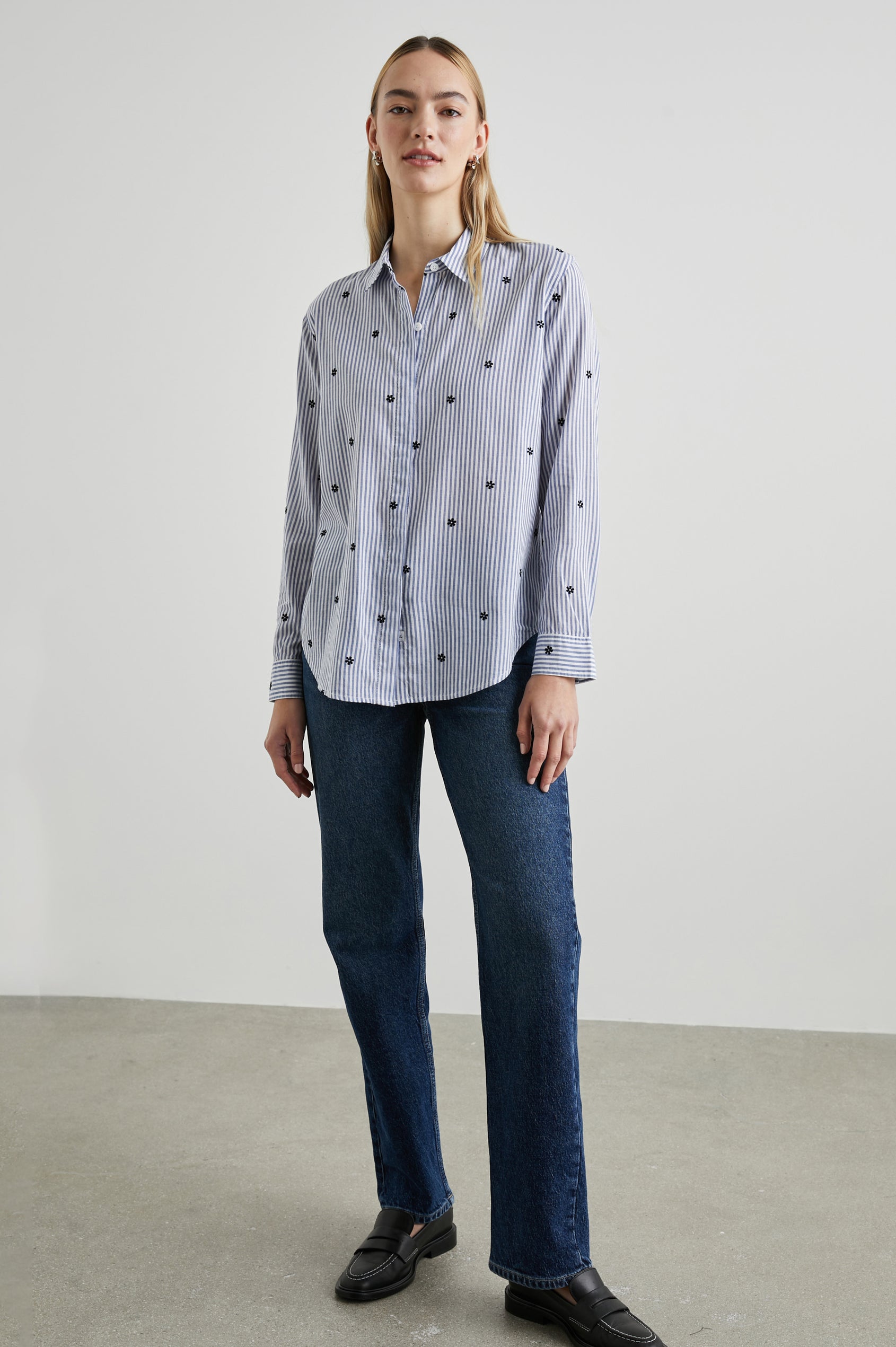 Taylor Long-Sleeve Button Up with Small Dark Navy Daisies in Flocked Daisies Colorway, with Blue and White Vertical Stripes - Front Full Body View Featured on Model