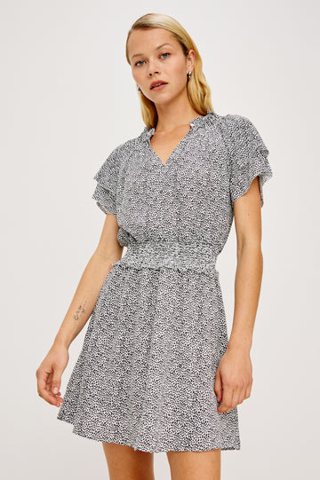 Terrin Mini Dress With Shirred Yoke, V-Neckline, Tiered Short Sleeves, Smocked Waist, and Fully Lined Skirt in Ivory Micro Spots Colorway - Full Body Front View Featured on Model