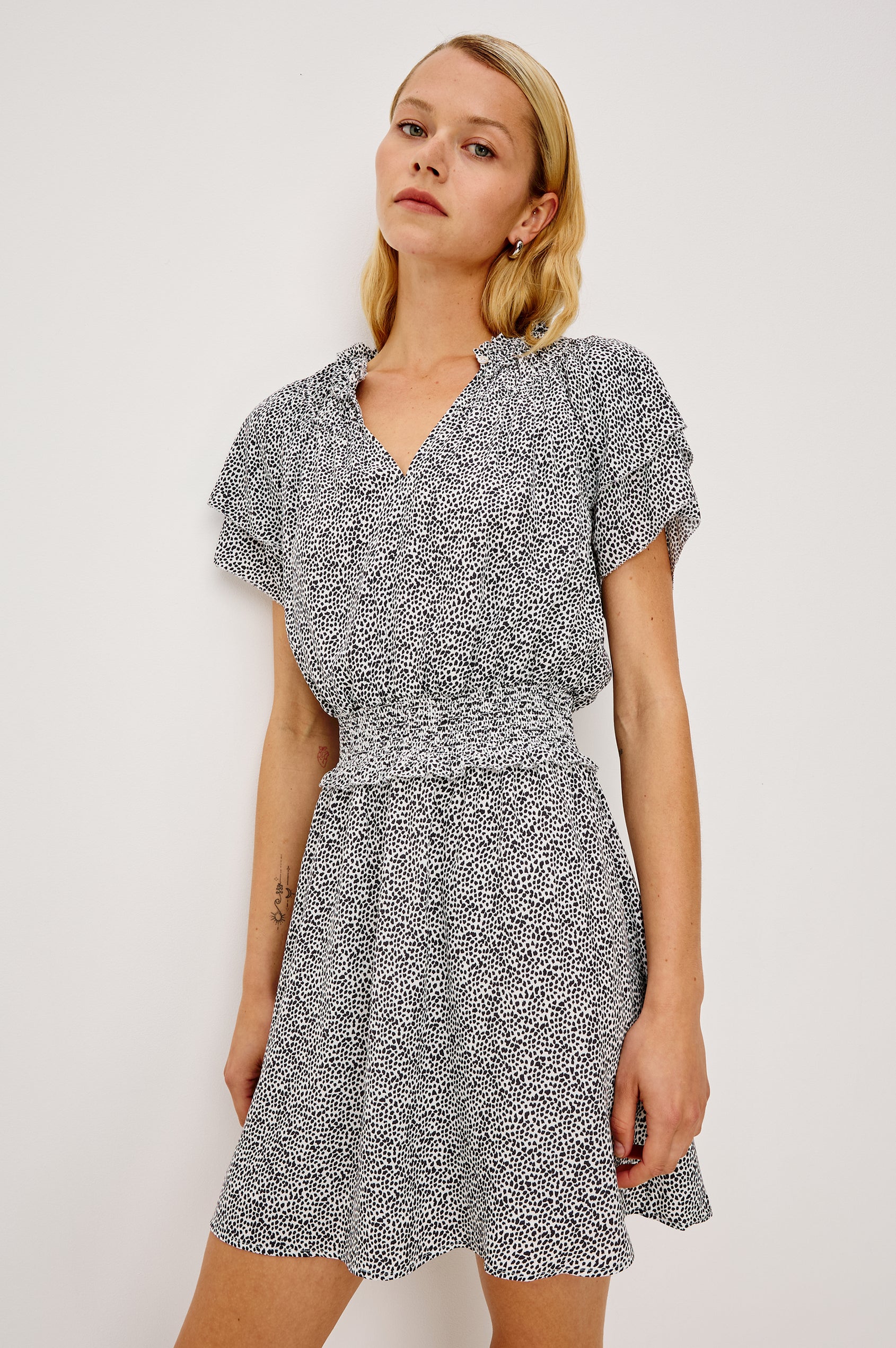 Terrin Mini Dress With Shirred Yoke, V-Neckline, Tiered Short Sleeves, Smocked Waist, and Fully Lined Skirt in Ivory Micro Spots Colorway - Full Body Front View Featured on Model