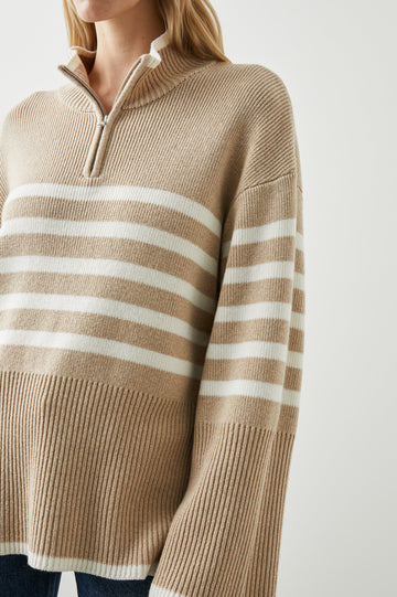 Tessa Long-Sleeve Ribbed Sweater with a Zipped Mock Neck, Wide Sleeves, and Thicker Ribbing at Trims in Sand Stripe Colorway, white horizontal stripes on Sand - Front View Featured on Model