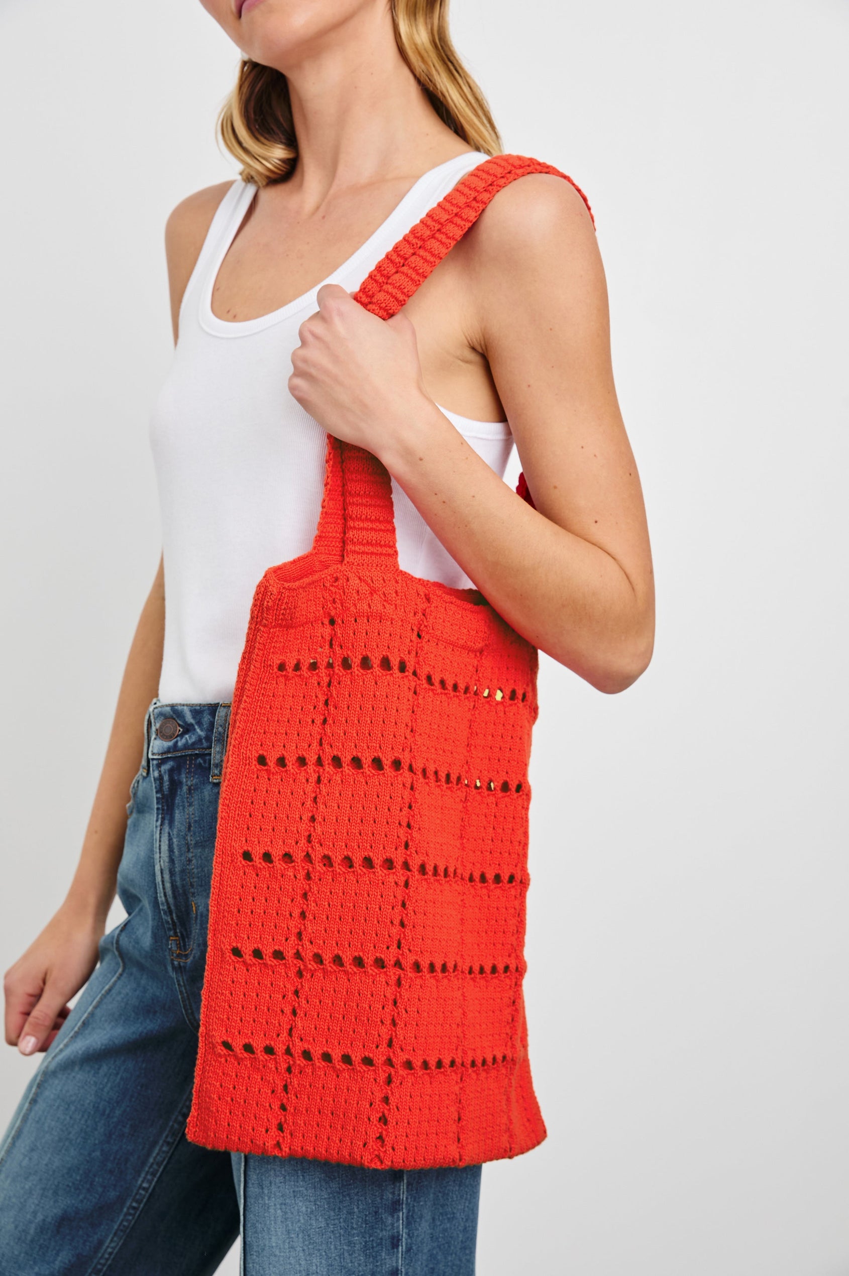 Crochet Rectangular Tote with Patchwork Grid Drop stiches in Cherry Colorway  - Side View Featured on Model